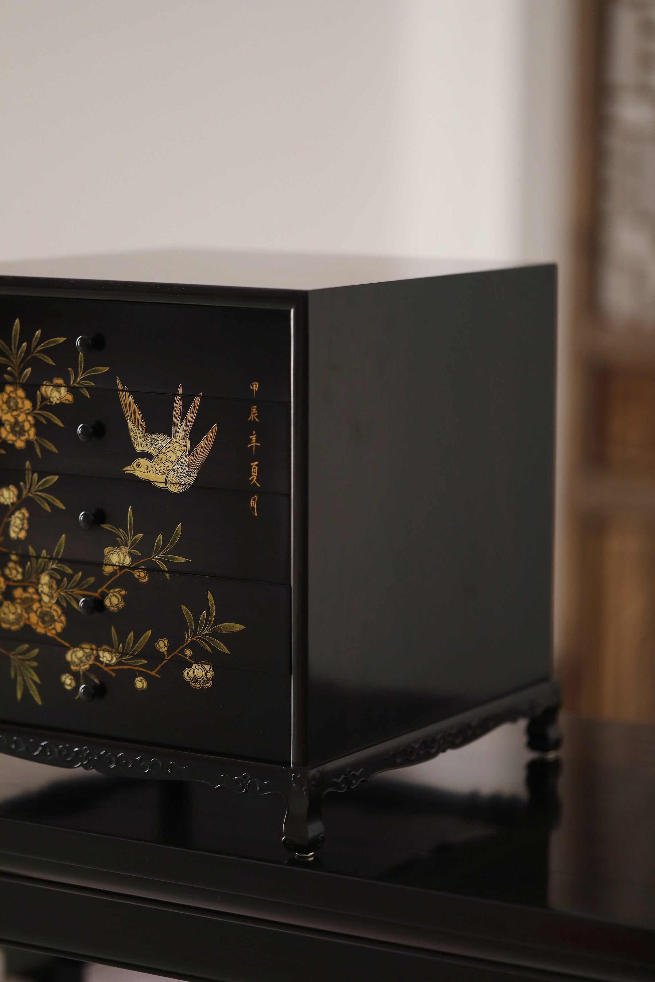 Gold piled high, joy on eyebrows / Wealth and good fortune on the table, five cups of tea on the sideboard