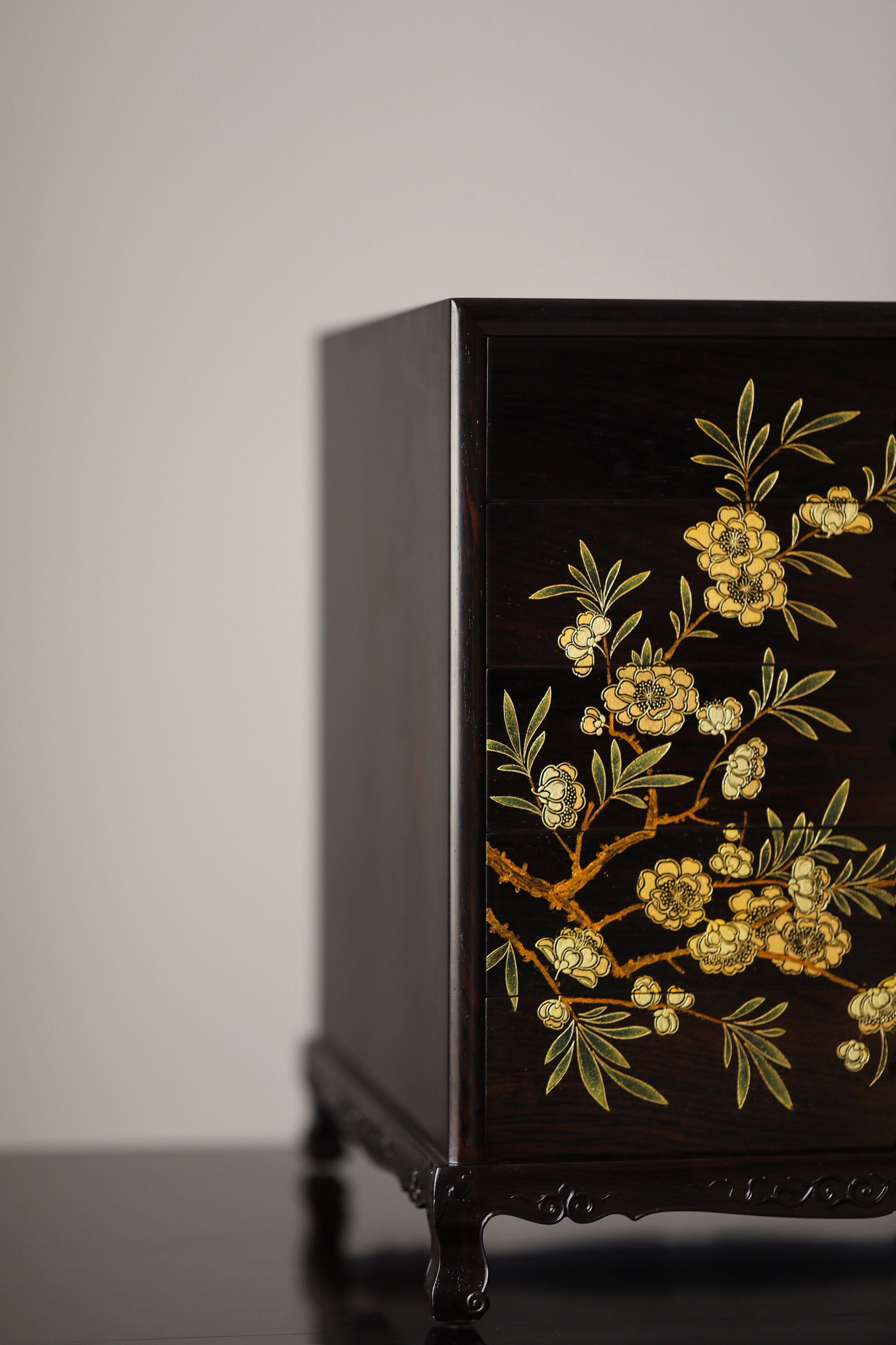 Gold piled high, joy on eyebrows / Wealth and good fortune on the table, five cups of tea on the sideboard