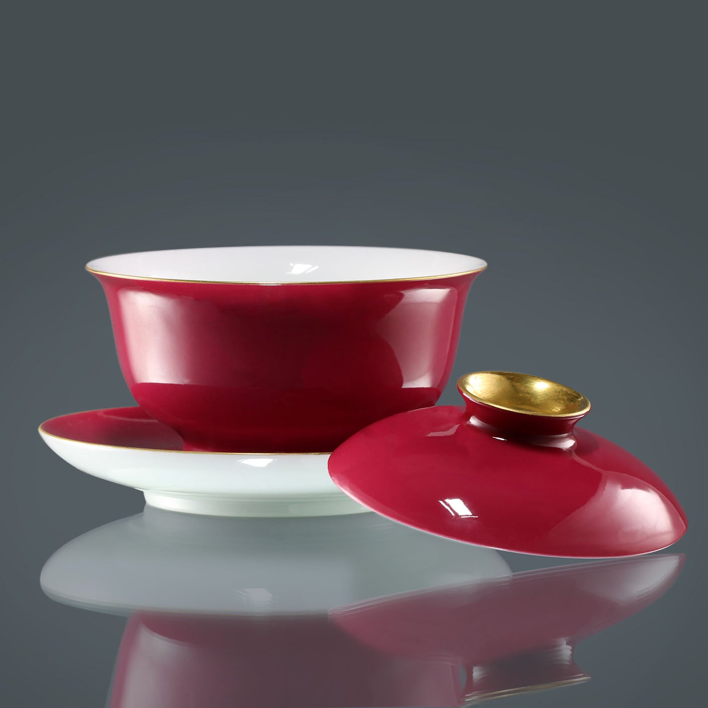 Rouge stains the bowl with gold, / Rouge leaves a trail of intoxication.