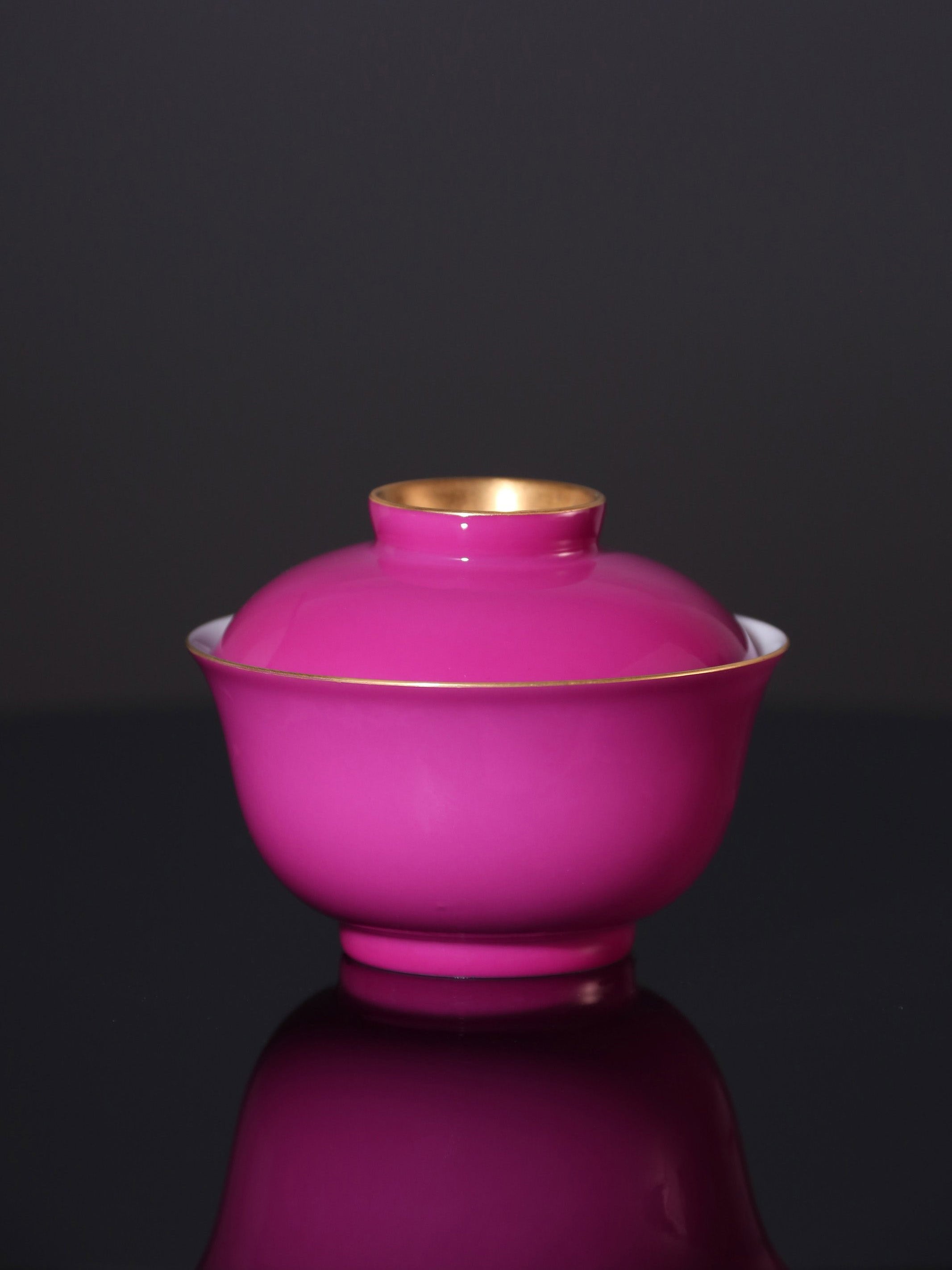 Rouge stains the bowl with gold, / Rouge leaves a trail of intoxication.