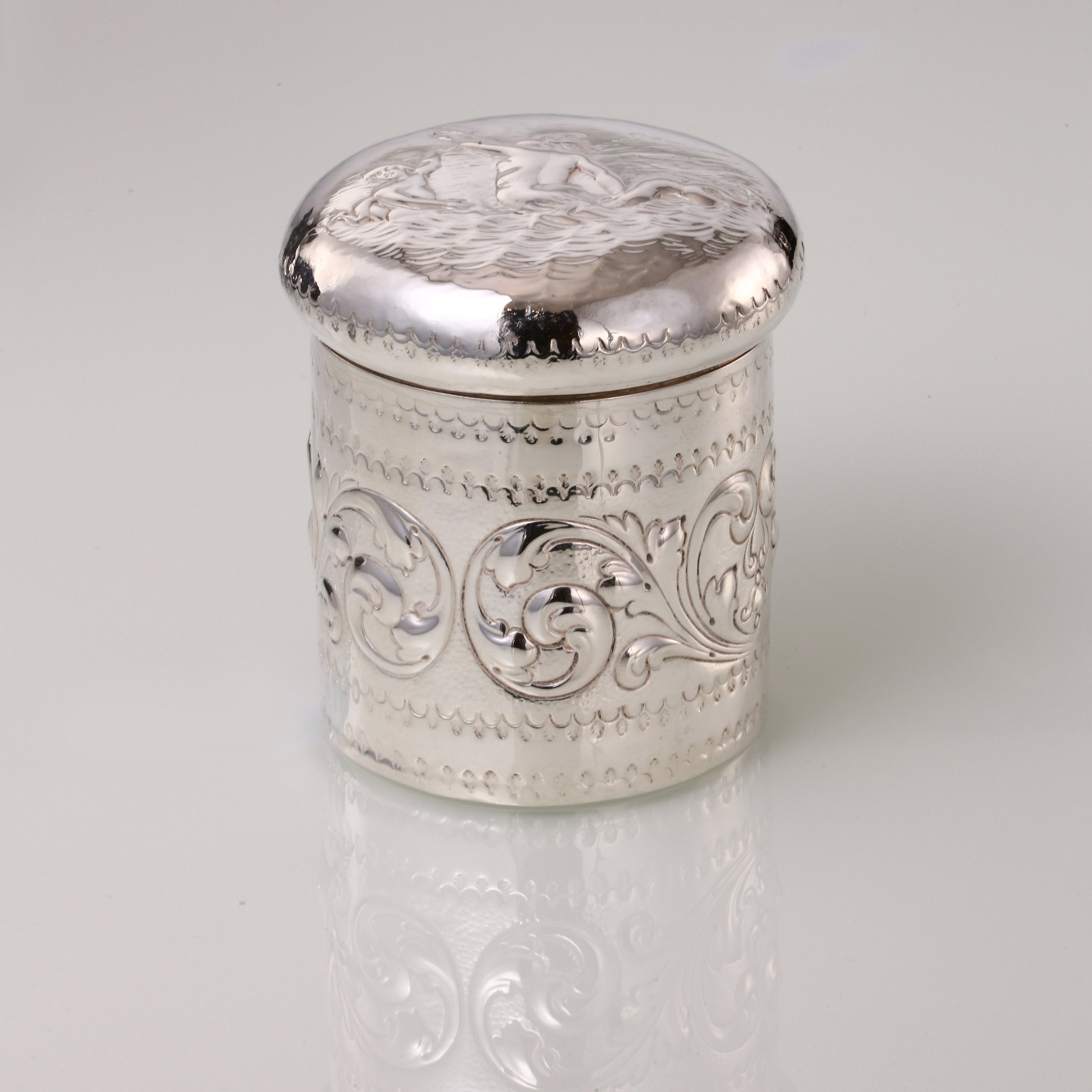 1884 British sterling silver tea caddy with relief floral and figure design