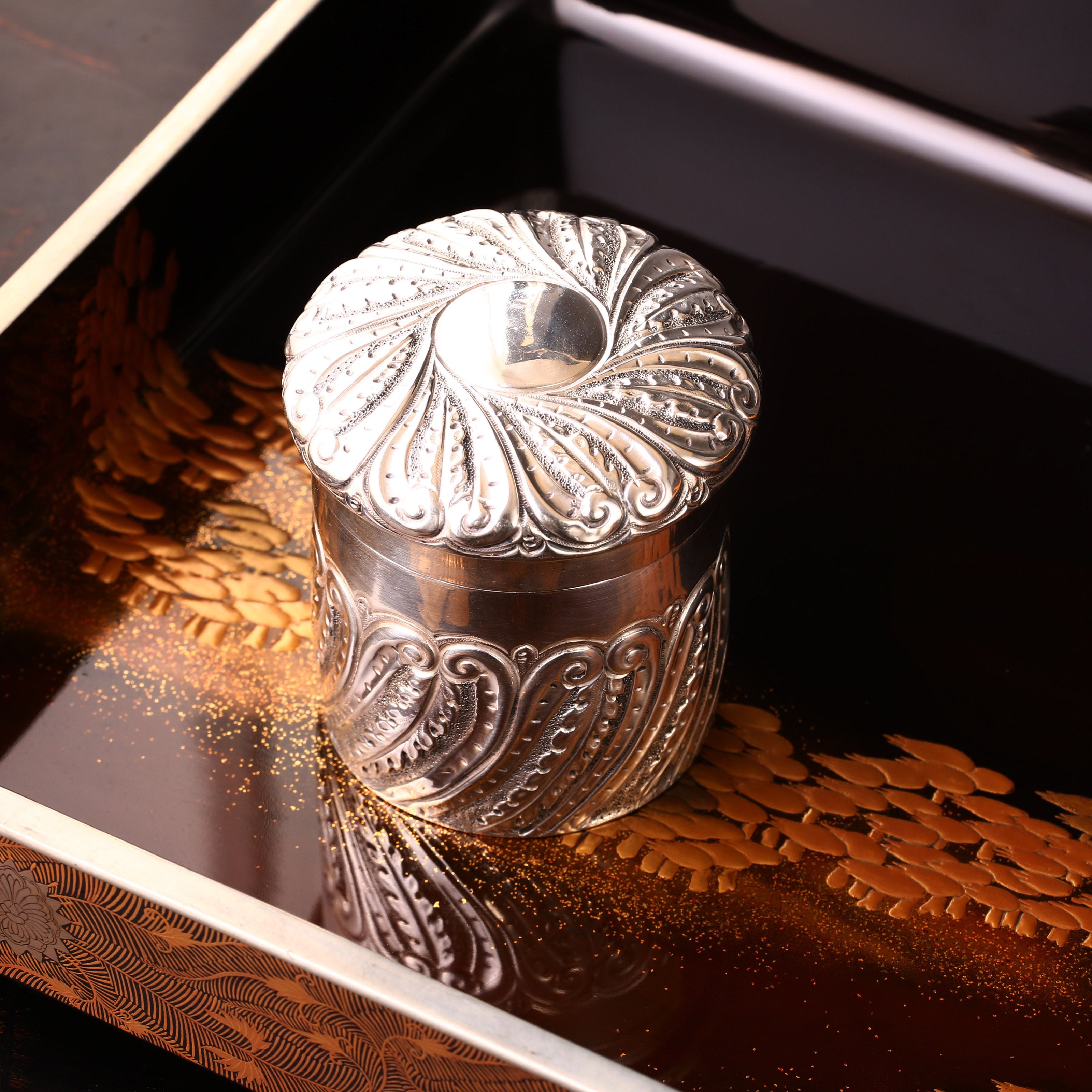 1901 British sterling silver tea caddy with scrollwork design