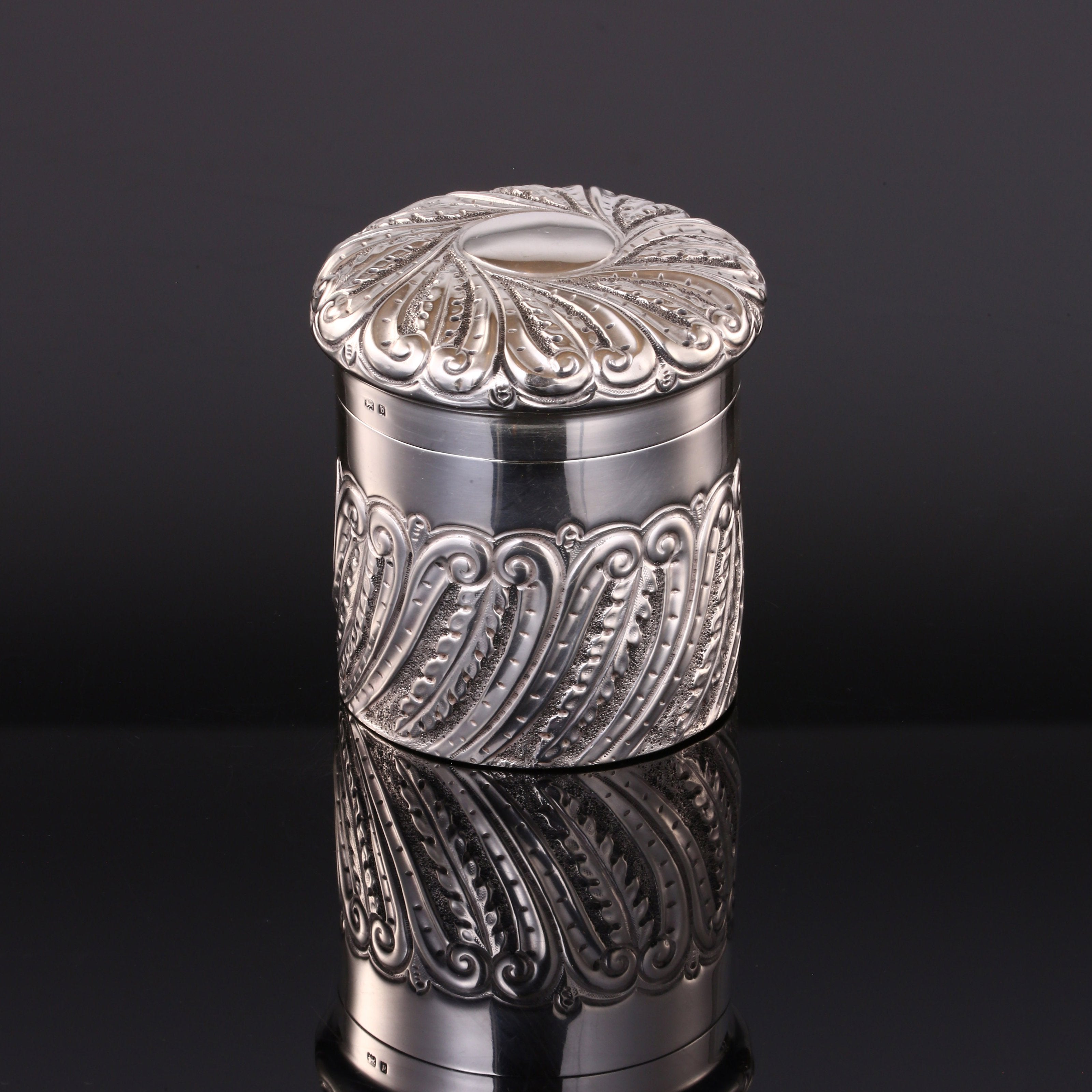 1901 British sterling silver tea caddy with scrollwork design