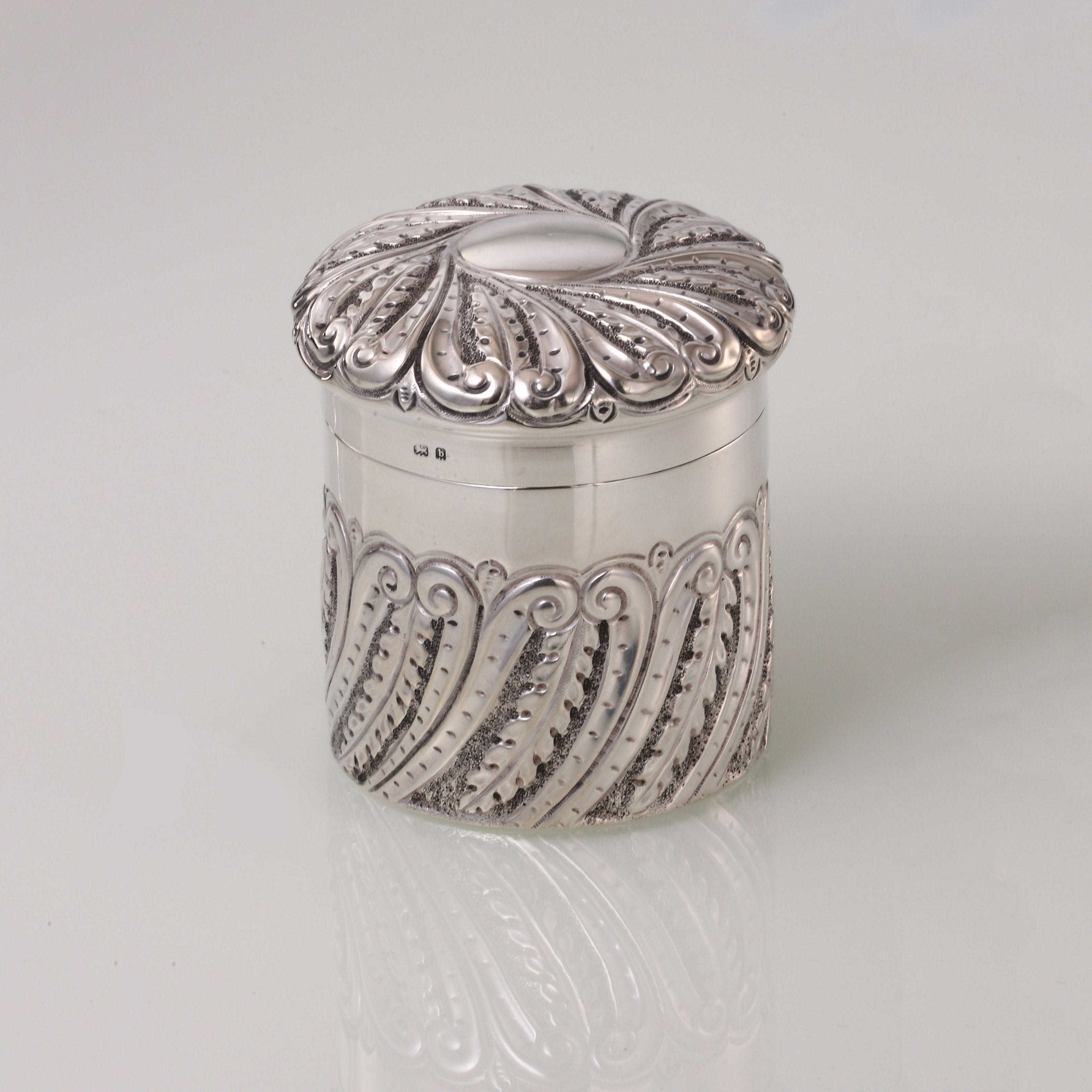 1901 British sterling silver tea caddy with scrollwork design