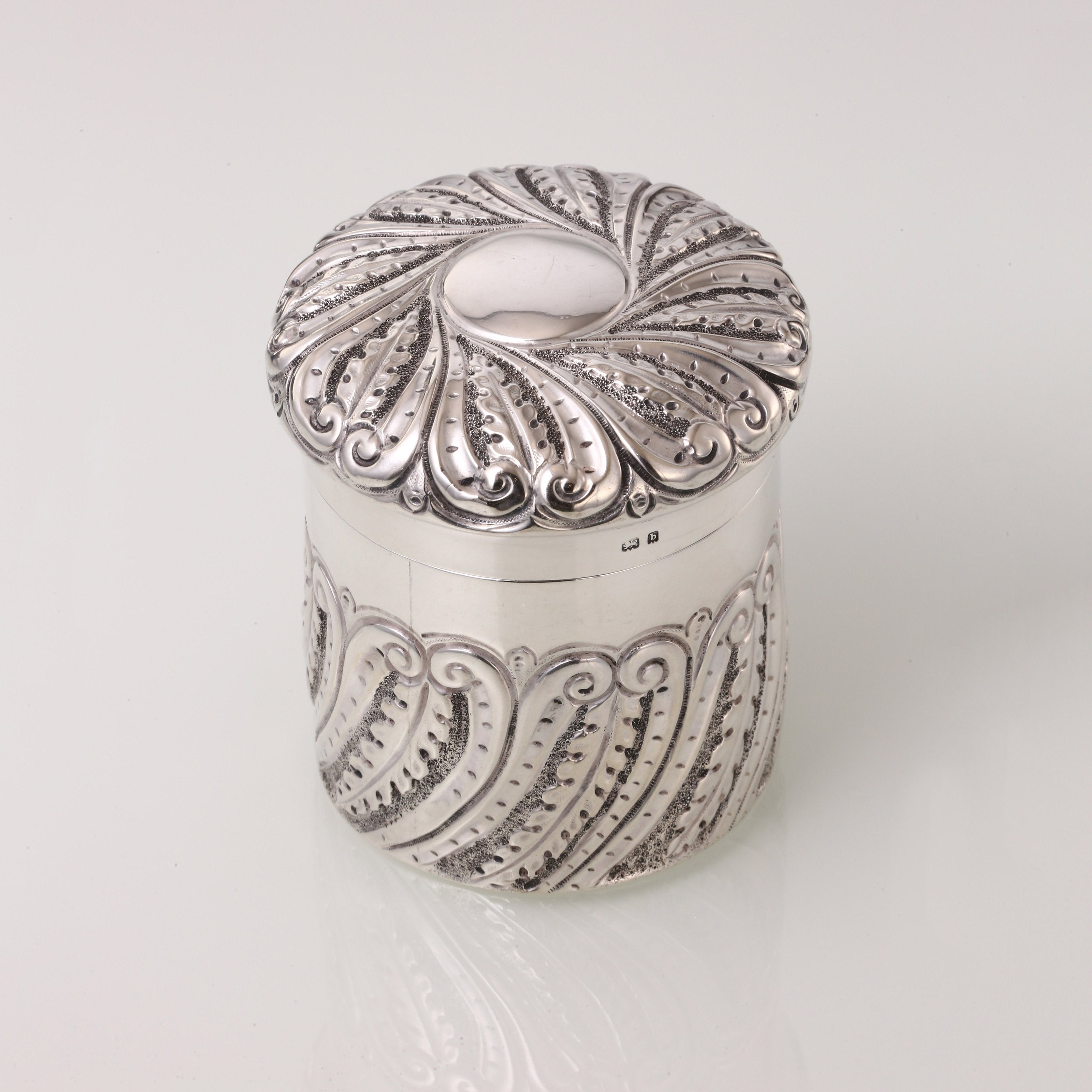 1901 British sterling silver tea caddy with scrollwork design