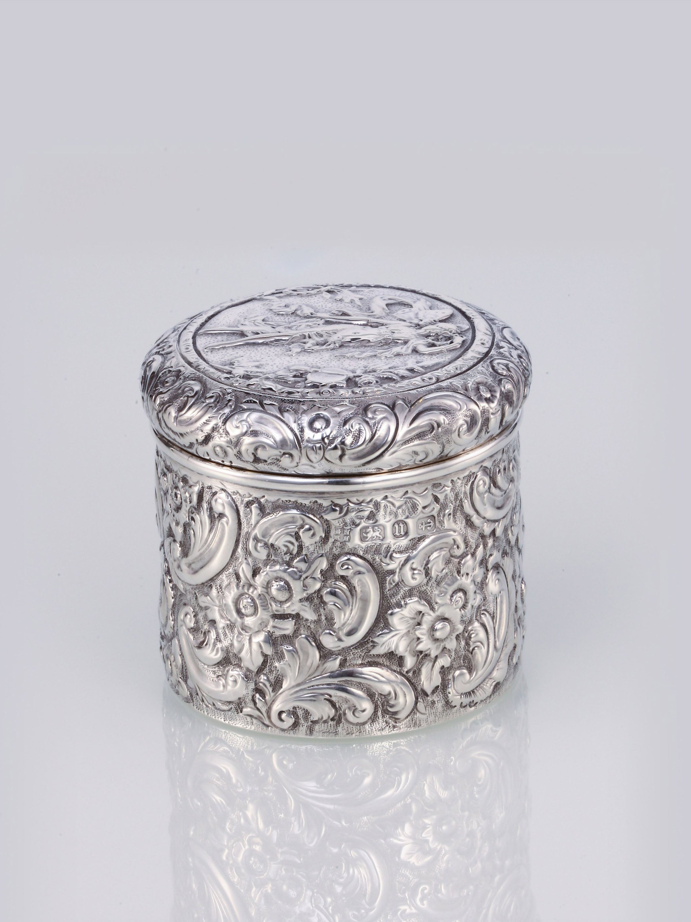 1894 British gilt-lined tea caddy with relief floral and figure design