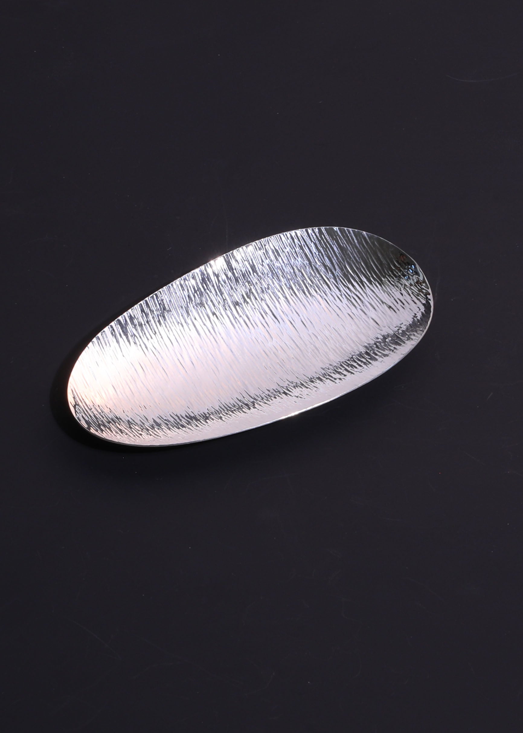 A piece of silver tea scoop