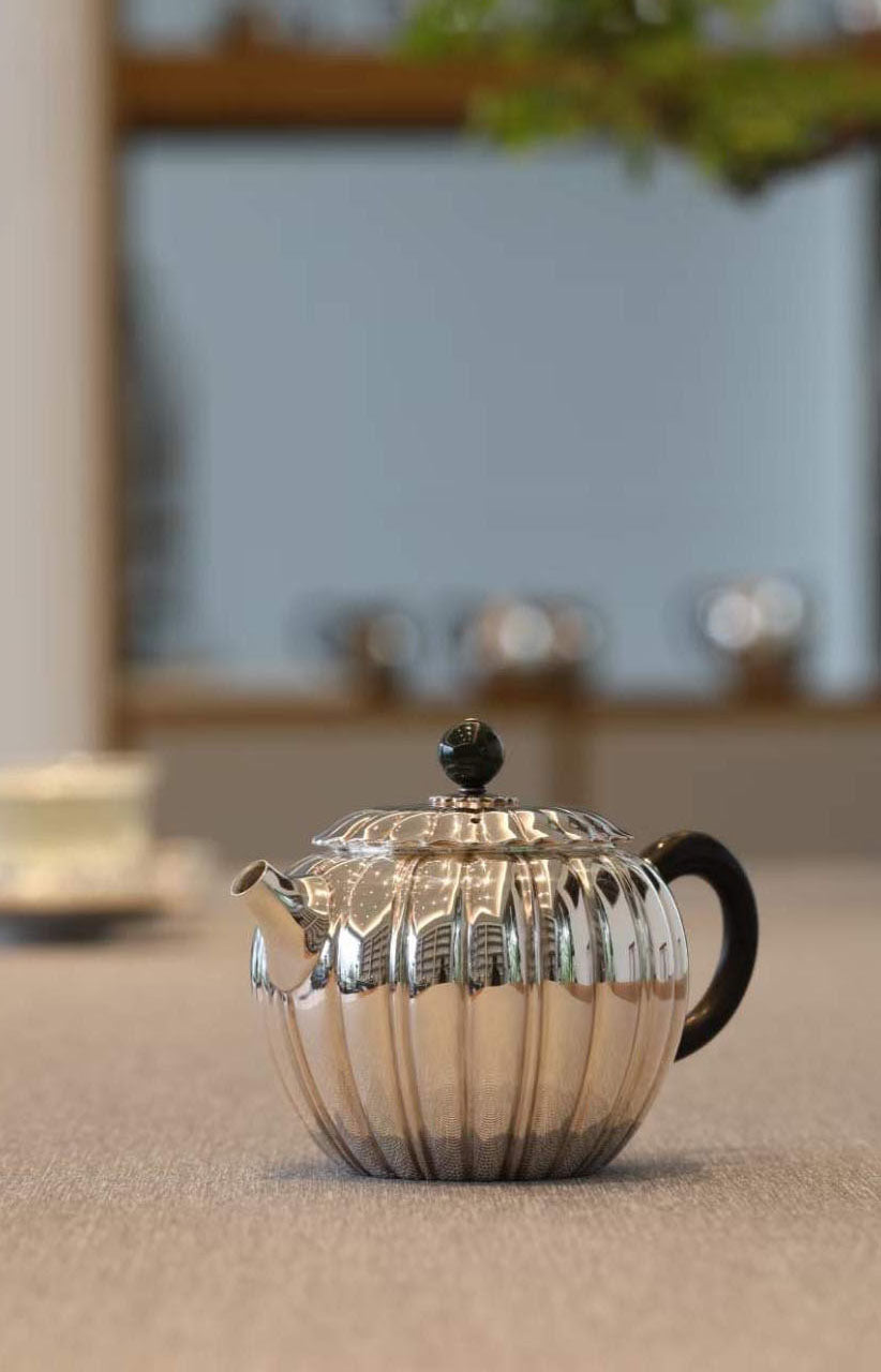 Jade-patterned sterling silver teapot