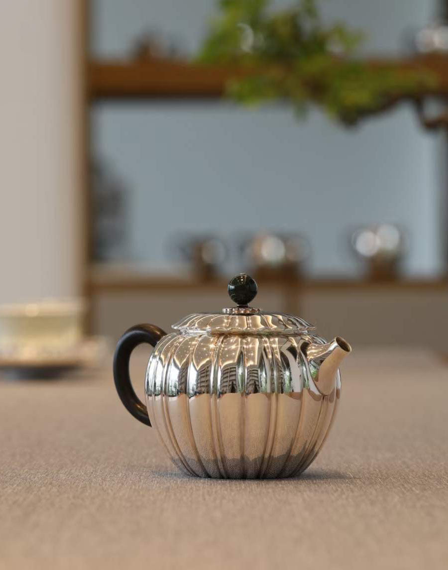 Jade-patterned sterling silver teapot