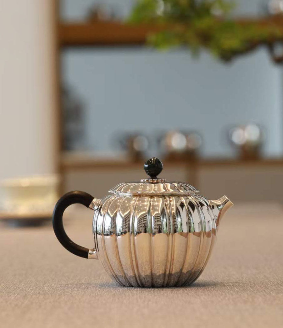 Jade-patterned sterling silver teapot