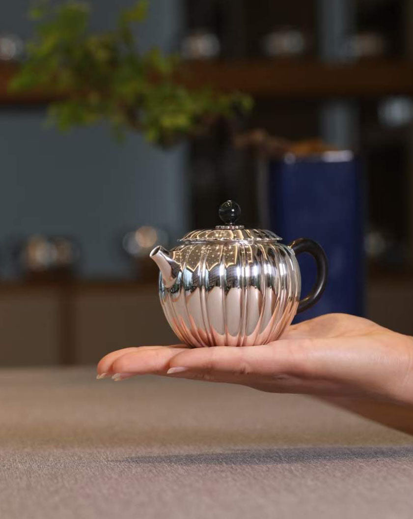 Jade-patterned sterling silver teapot