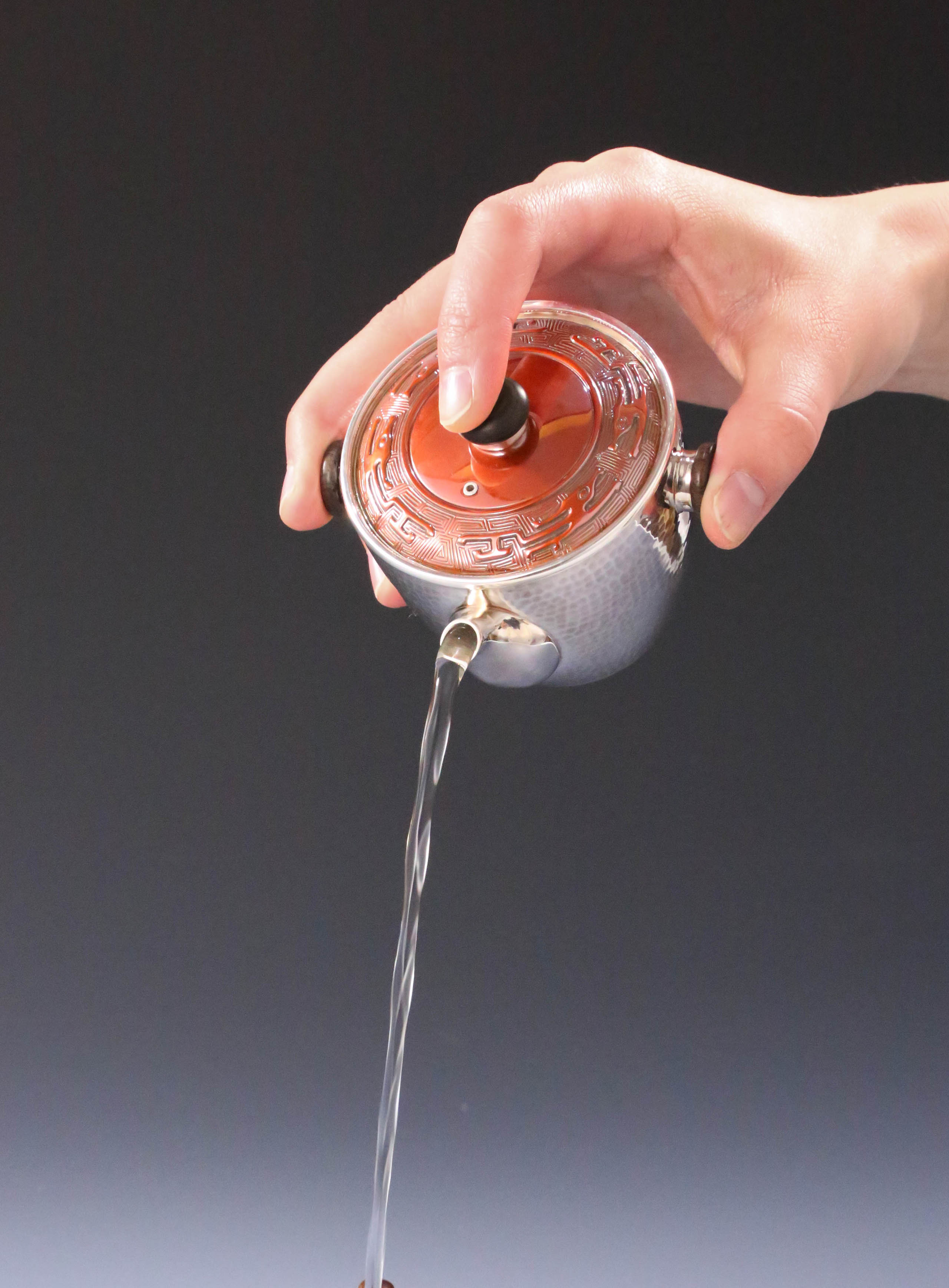 Vermilion-covered silver teapot