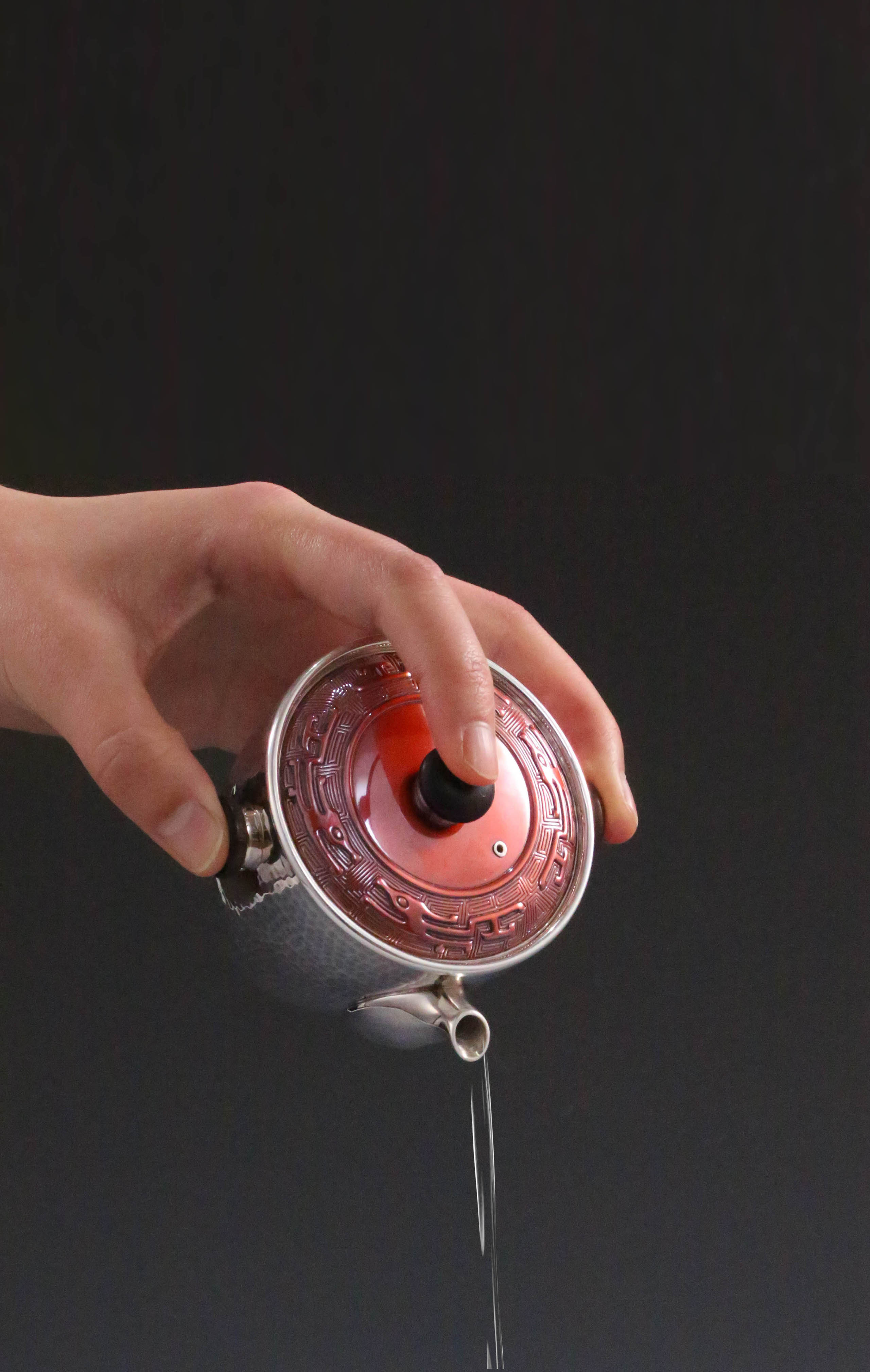 Vermilion-covered silver teapot