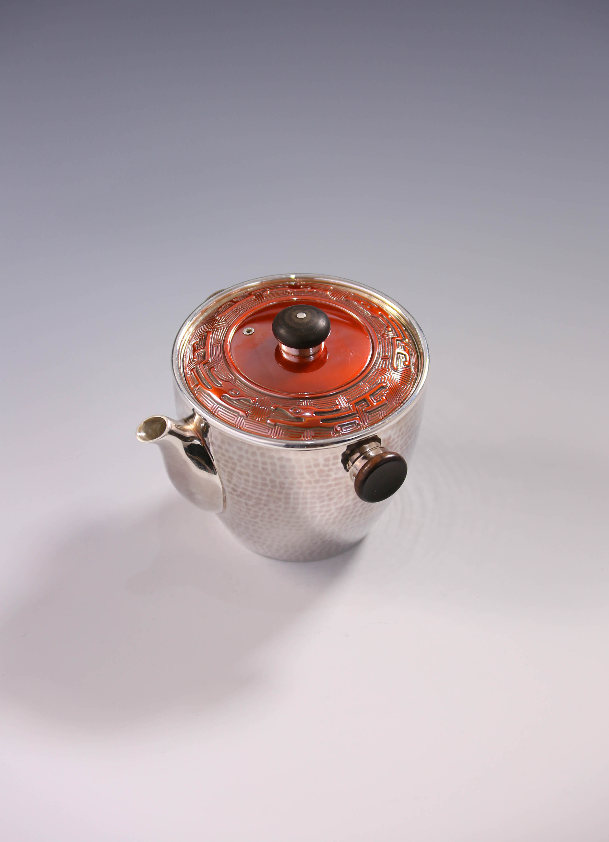 Vermilion-covered silver teapot