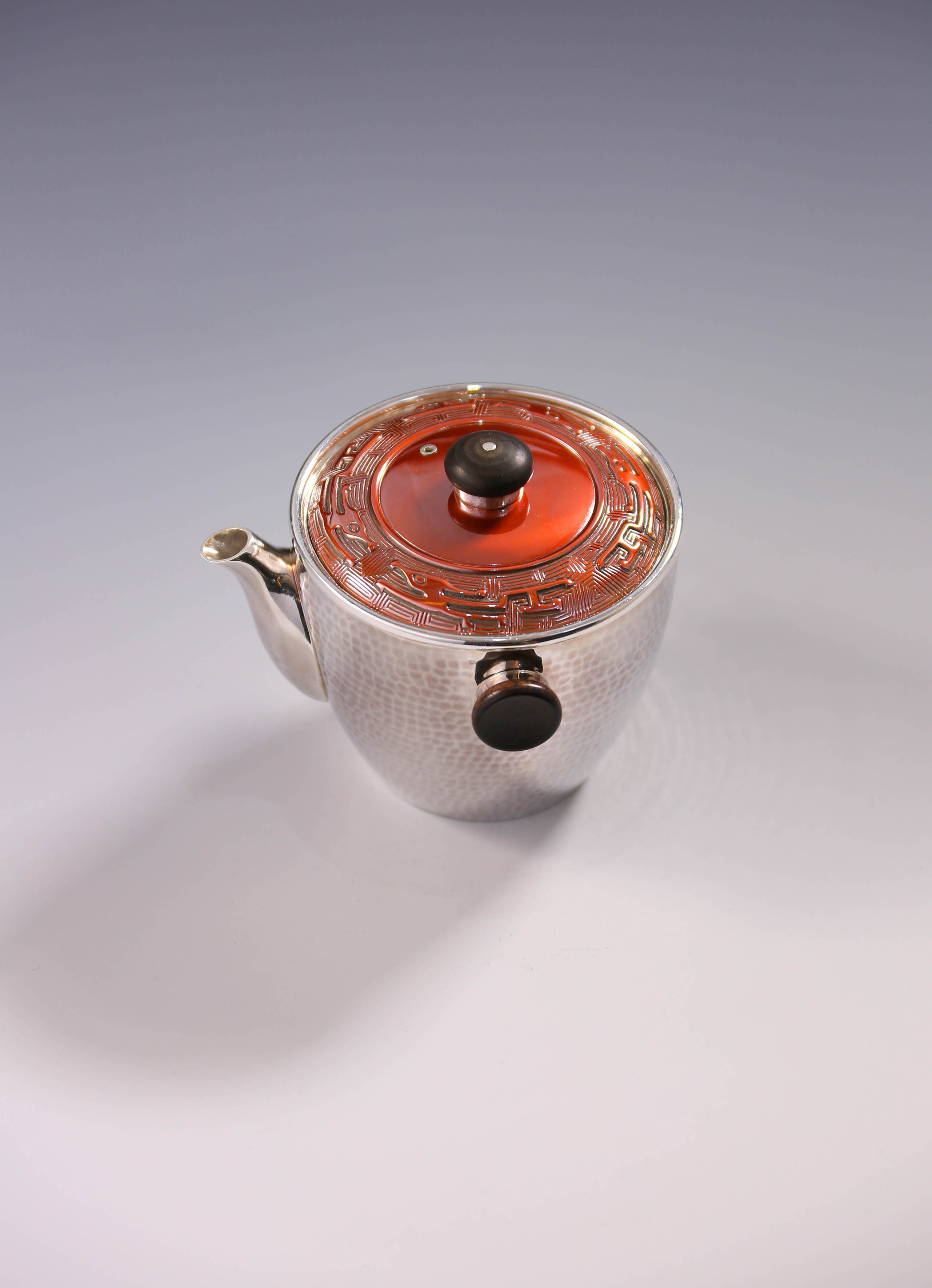 Vermilion-covered silver teapot