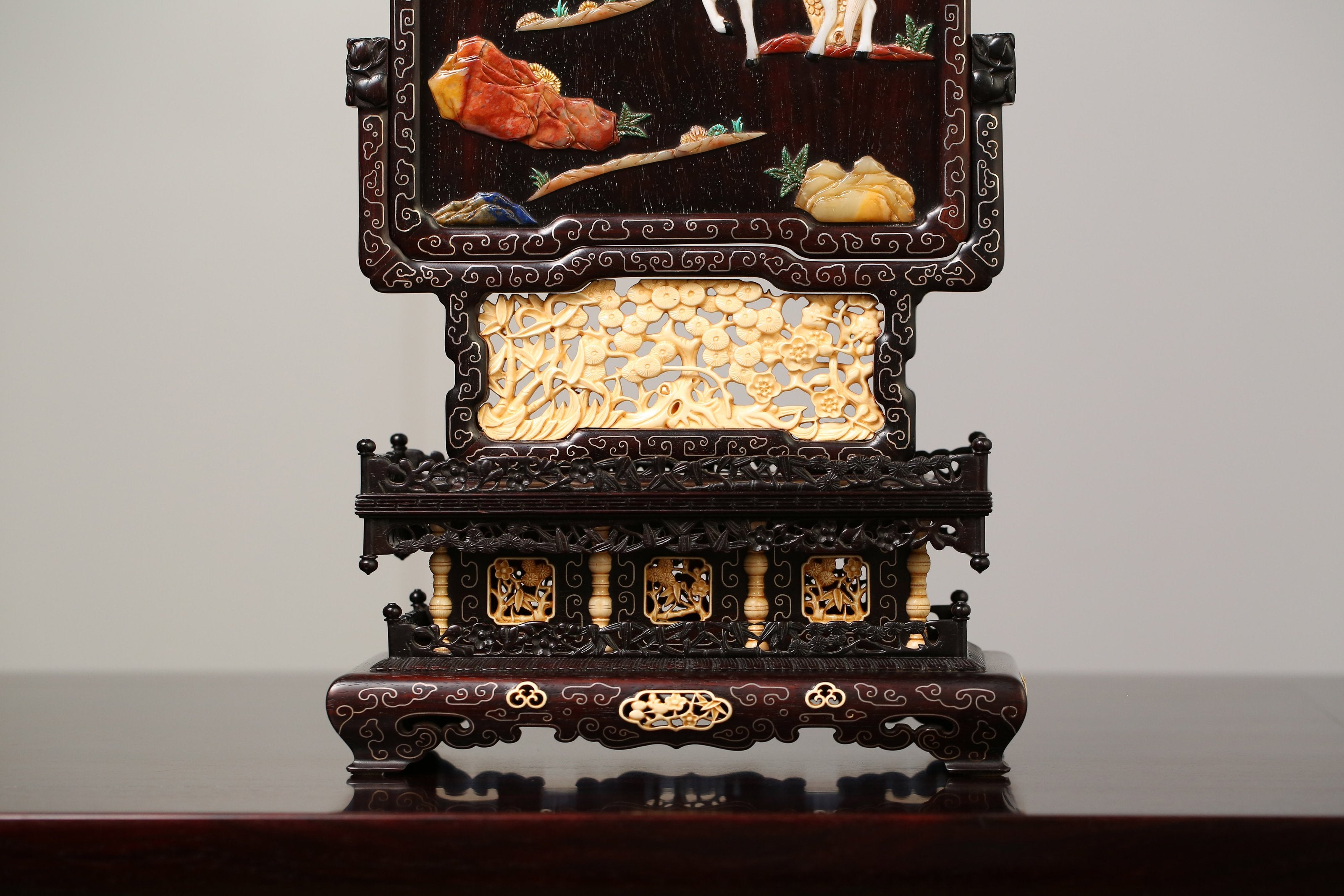 Rosewood screen inlaid with precious stones and mammoth ivory