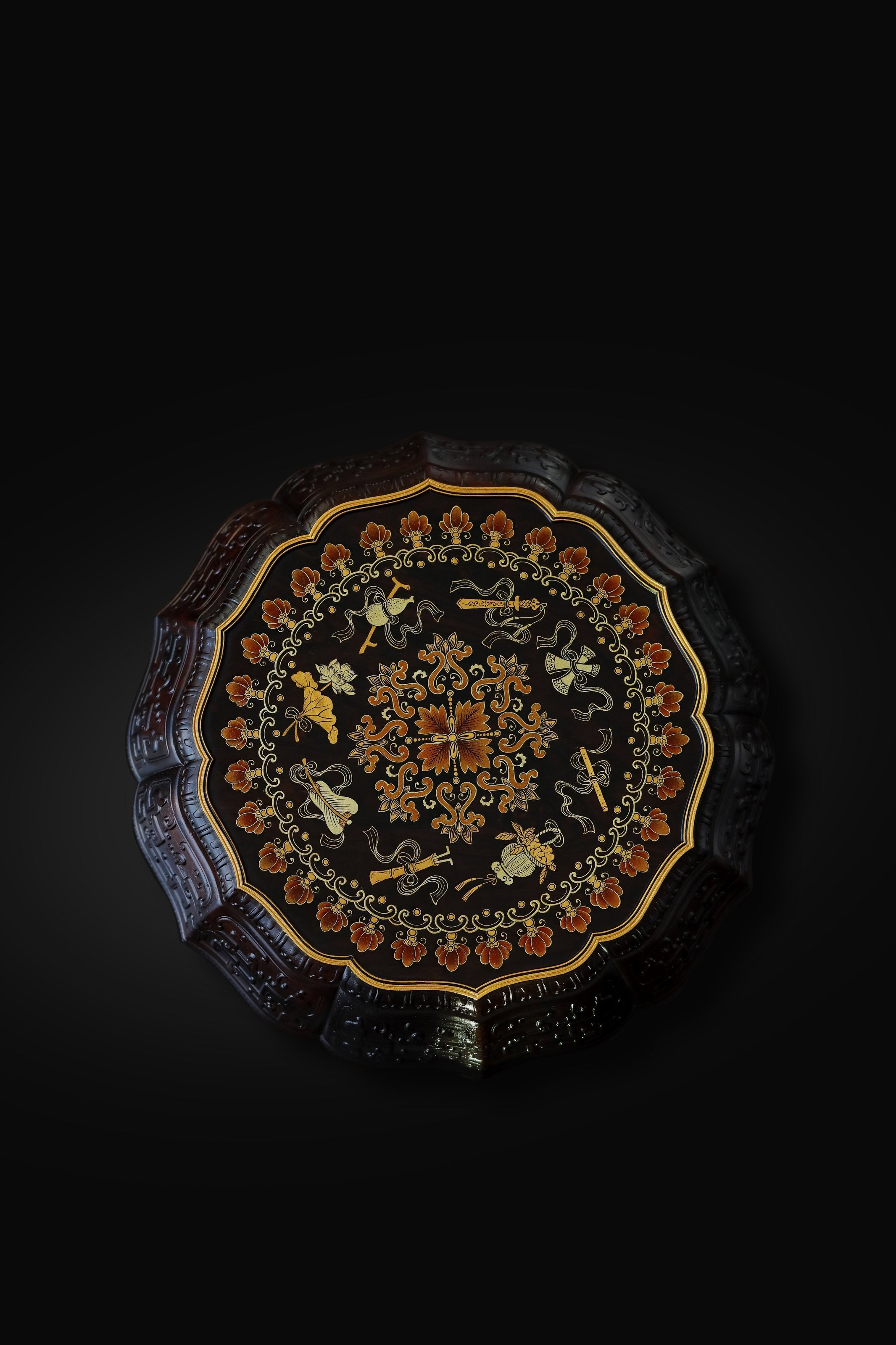 Purple sandalwood twelve-cornered fruit box with gilded Eight Immortals design and sunflower-shaped opening.