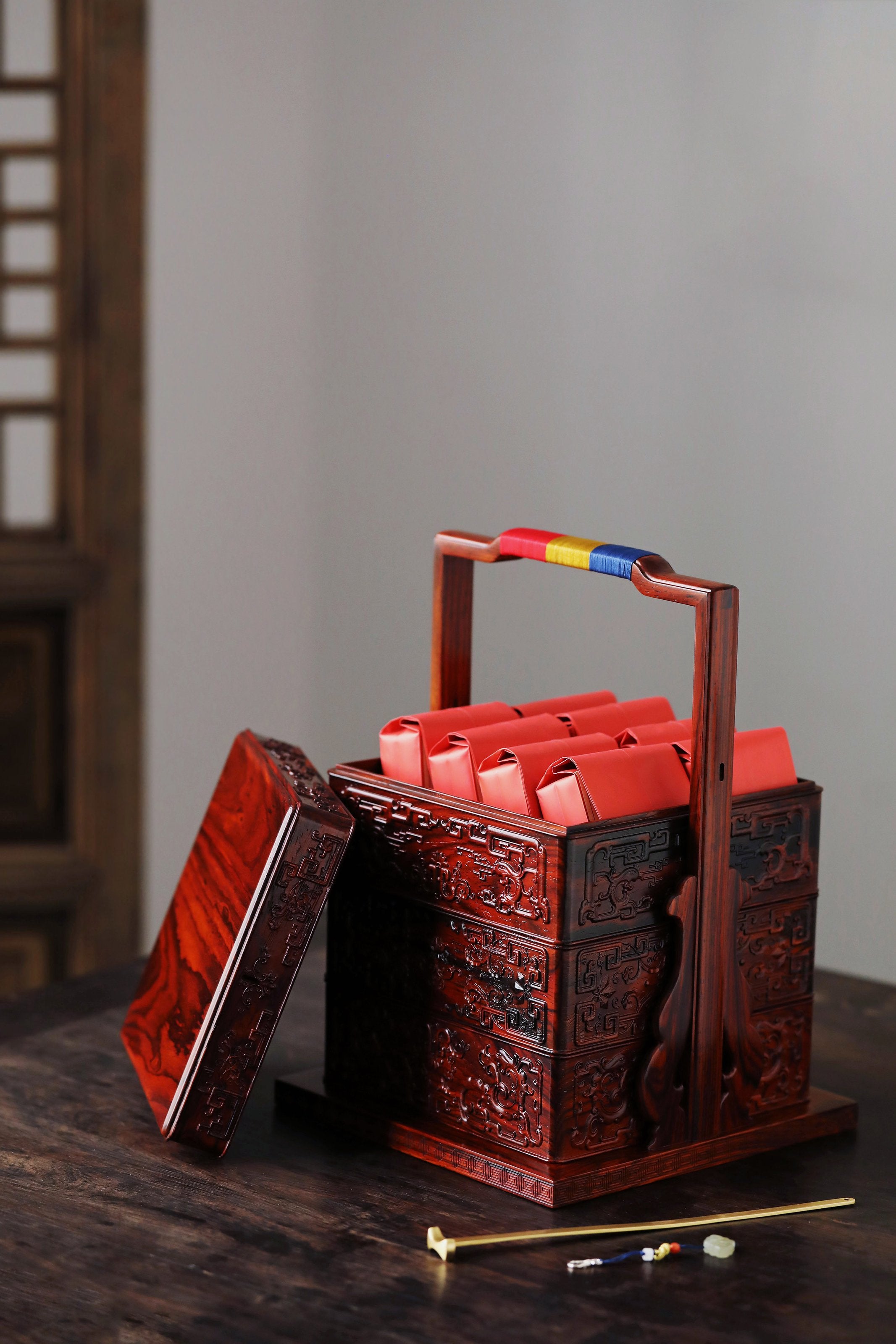 Rosewood square box with carved dragon and phoenix patterns