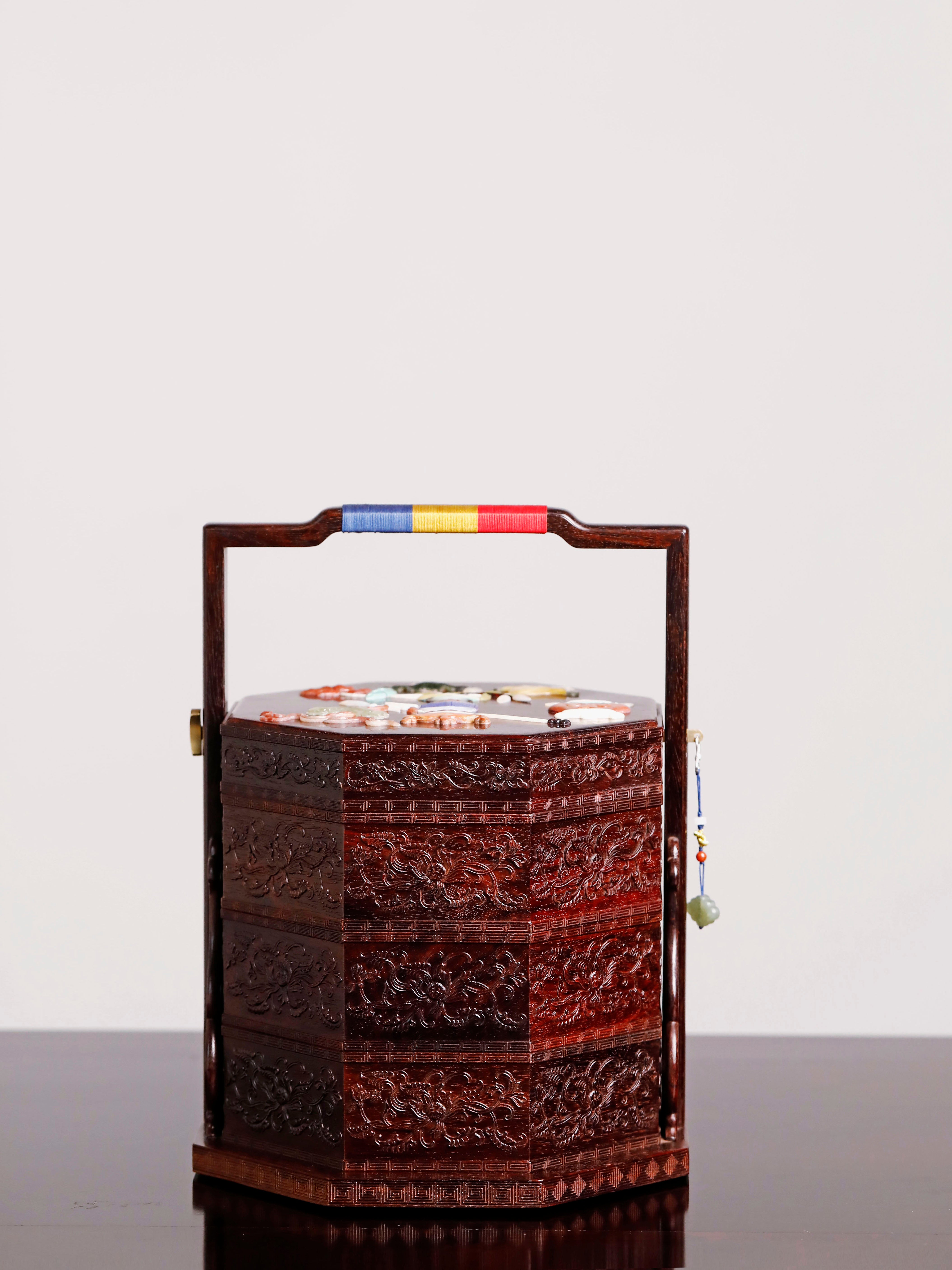 Small-leaf sandalwood octagonal box inlaid with precious stones, symbolizing joy and laughter.