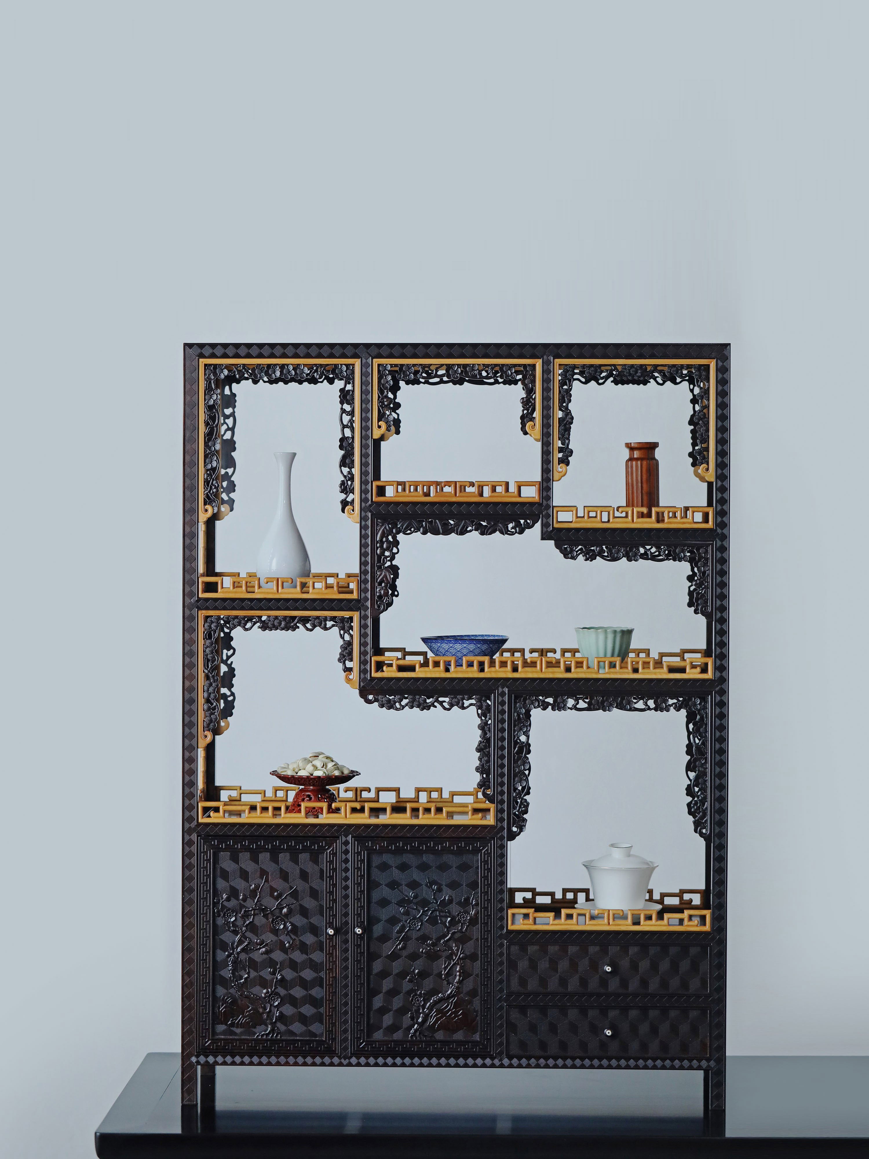 Purple sandalwood table with boxwood brocade pattern and plum blossom branch display shelf