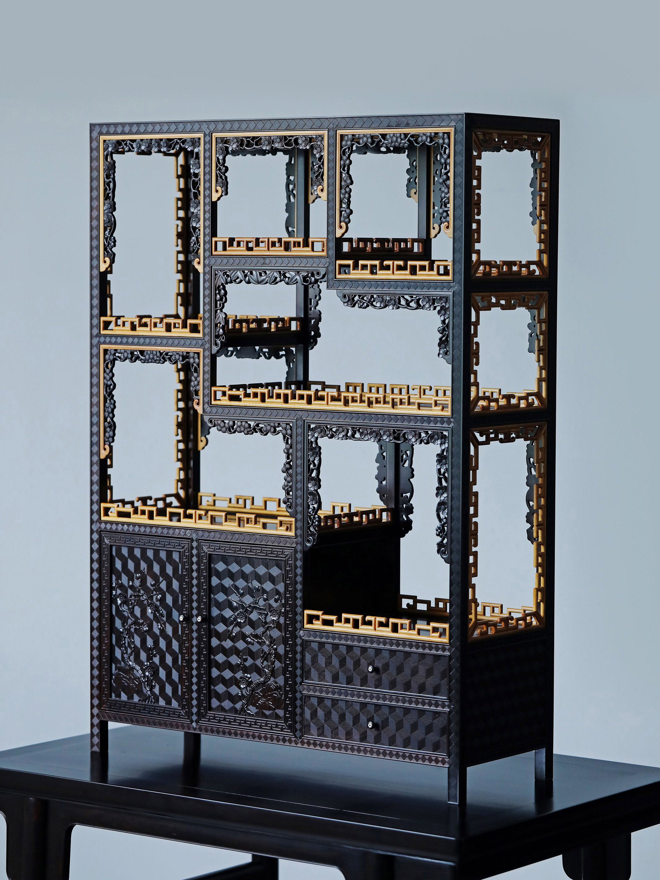 Purple sandalwood table with boxwood brocade pattern and plum blossom branch display shelf