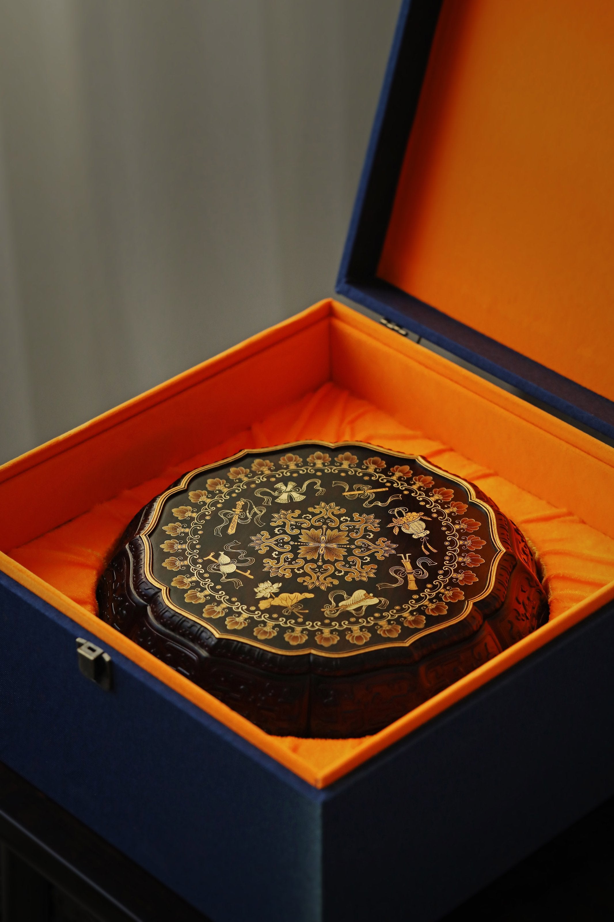 Purple sandalwood twelve-cornered fruit box with gilded Eight Immortals design and sunflower-shaped opening.