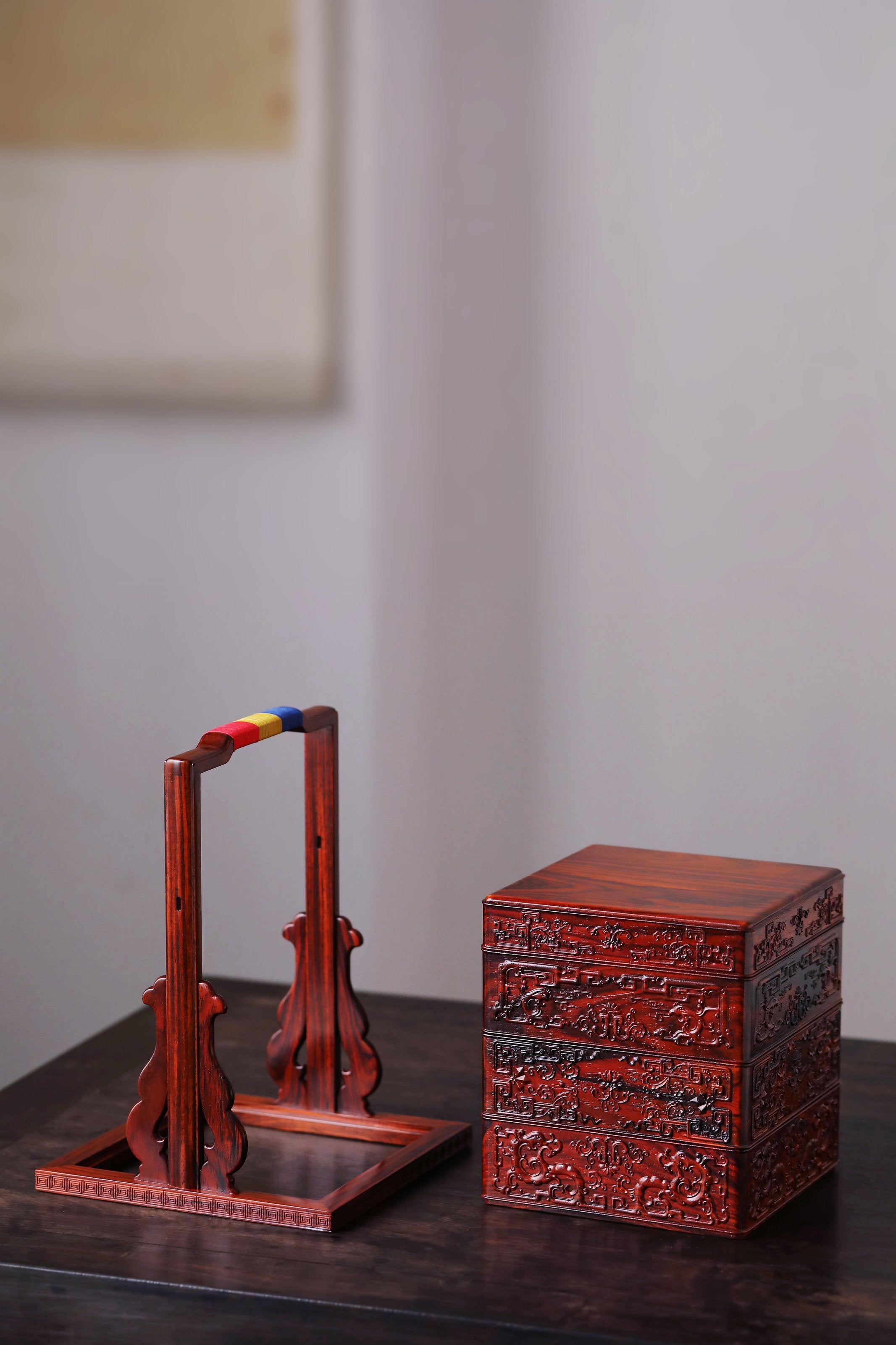 Rosewood square box with carved dragon and phoenix patterns