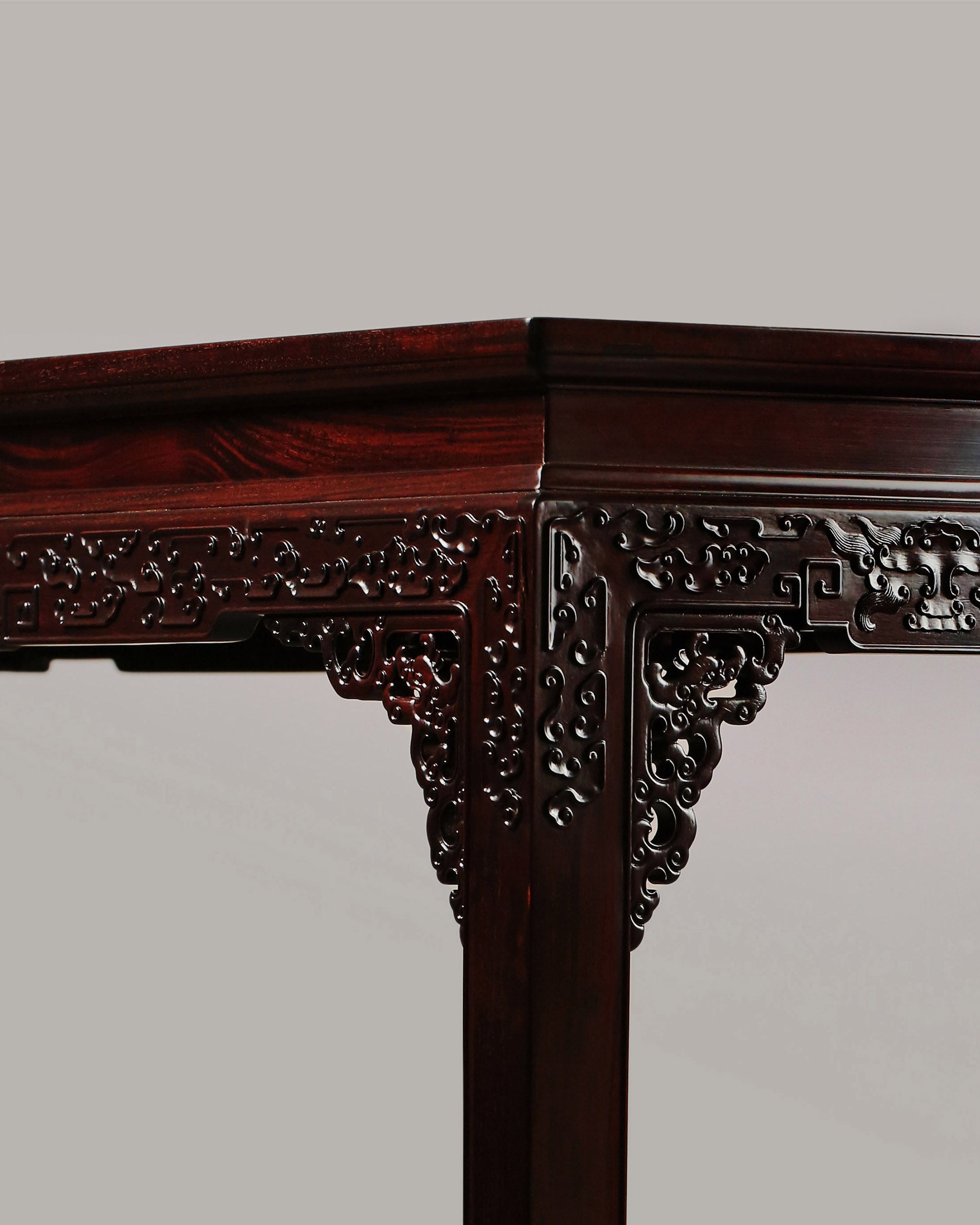A large rosewood table with taotie design, made for the Qing Dynasty imperial court.