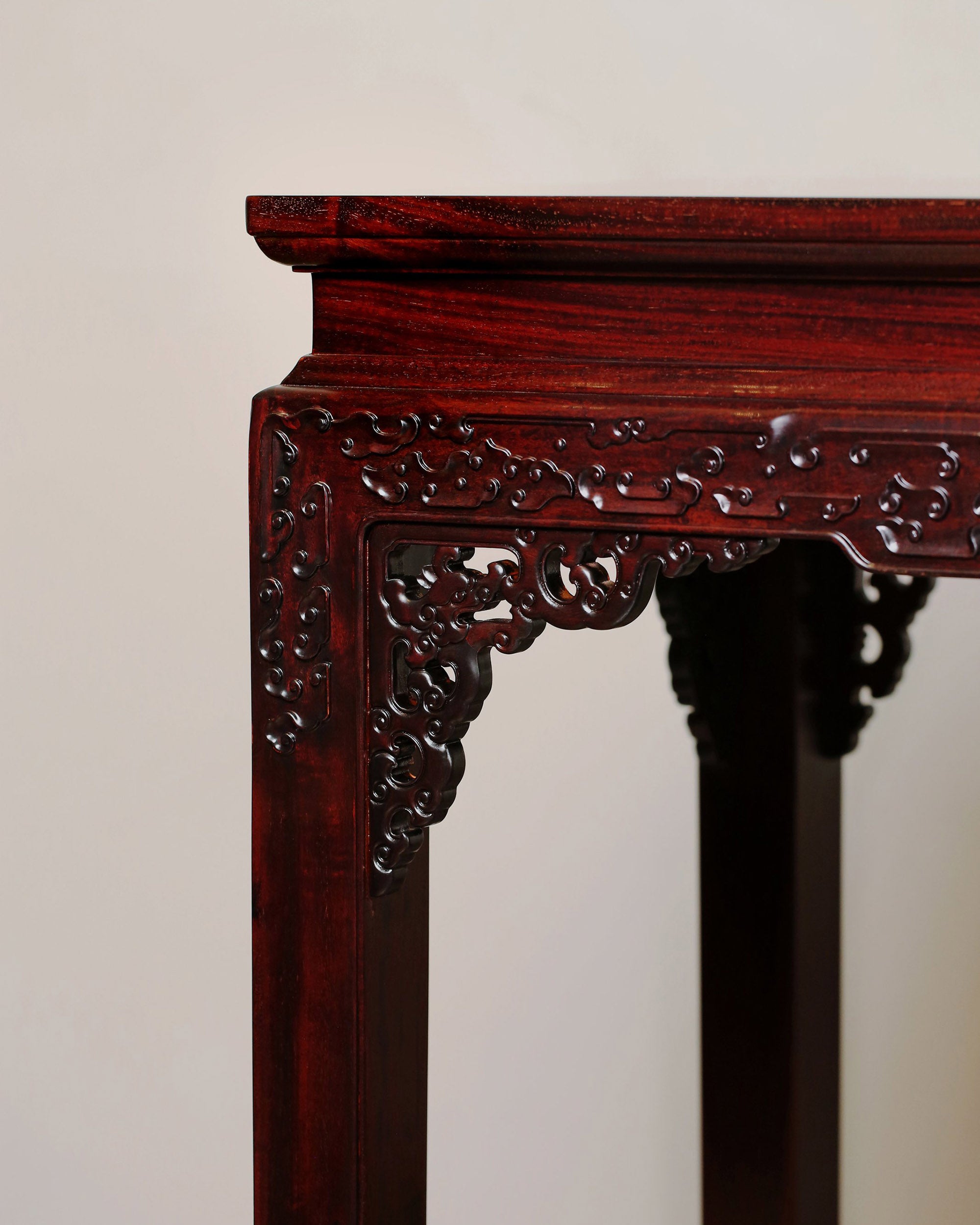 A large rosewood table with taotie design, made for the Qing Dynasty imperial court.