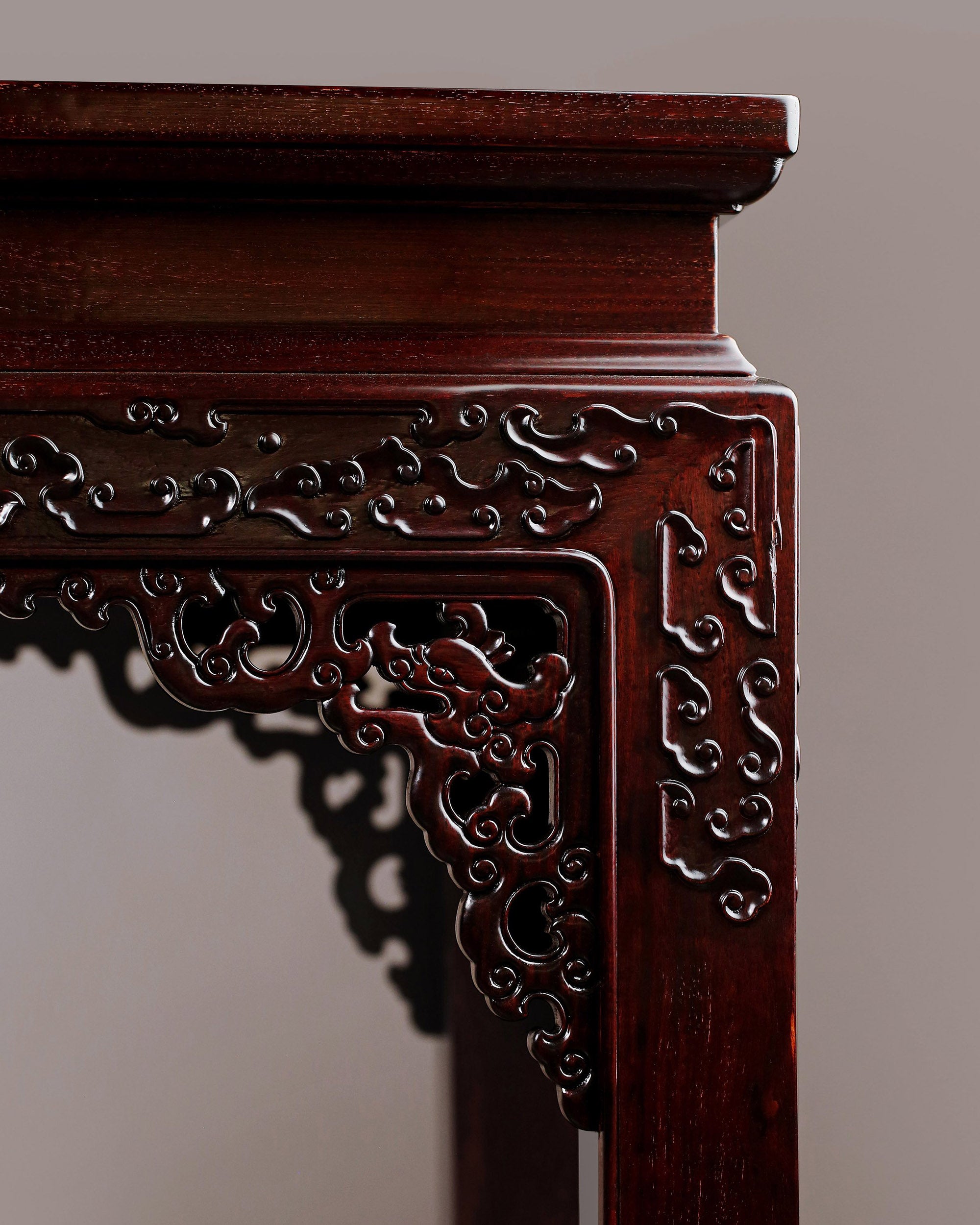 A large rosewood table with taotie design, made for the Qing Dynasty imperial court.