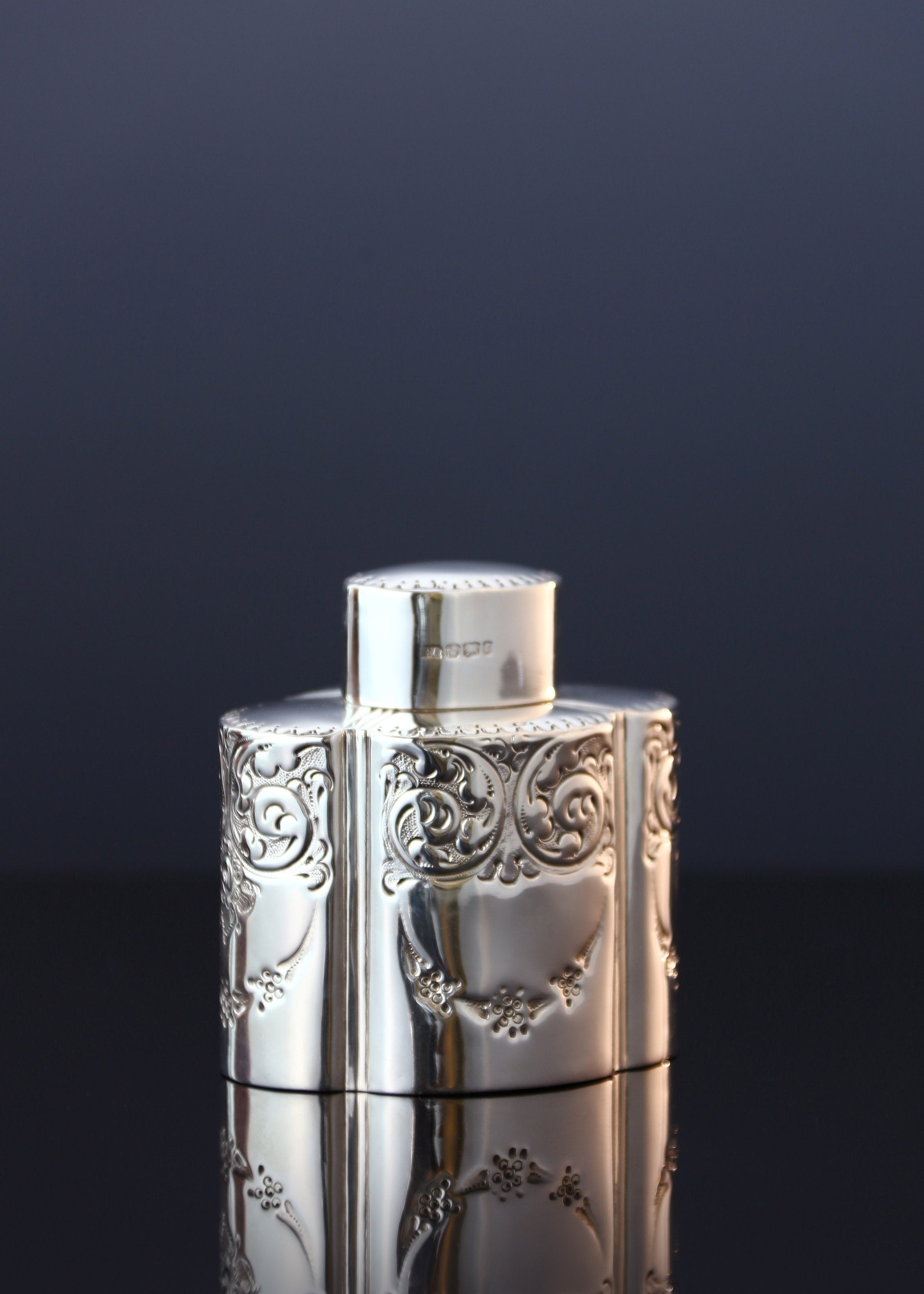 Atkin made sterling silver tea caddies in Sheffield in 1895.