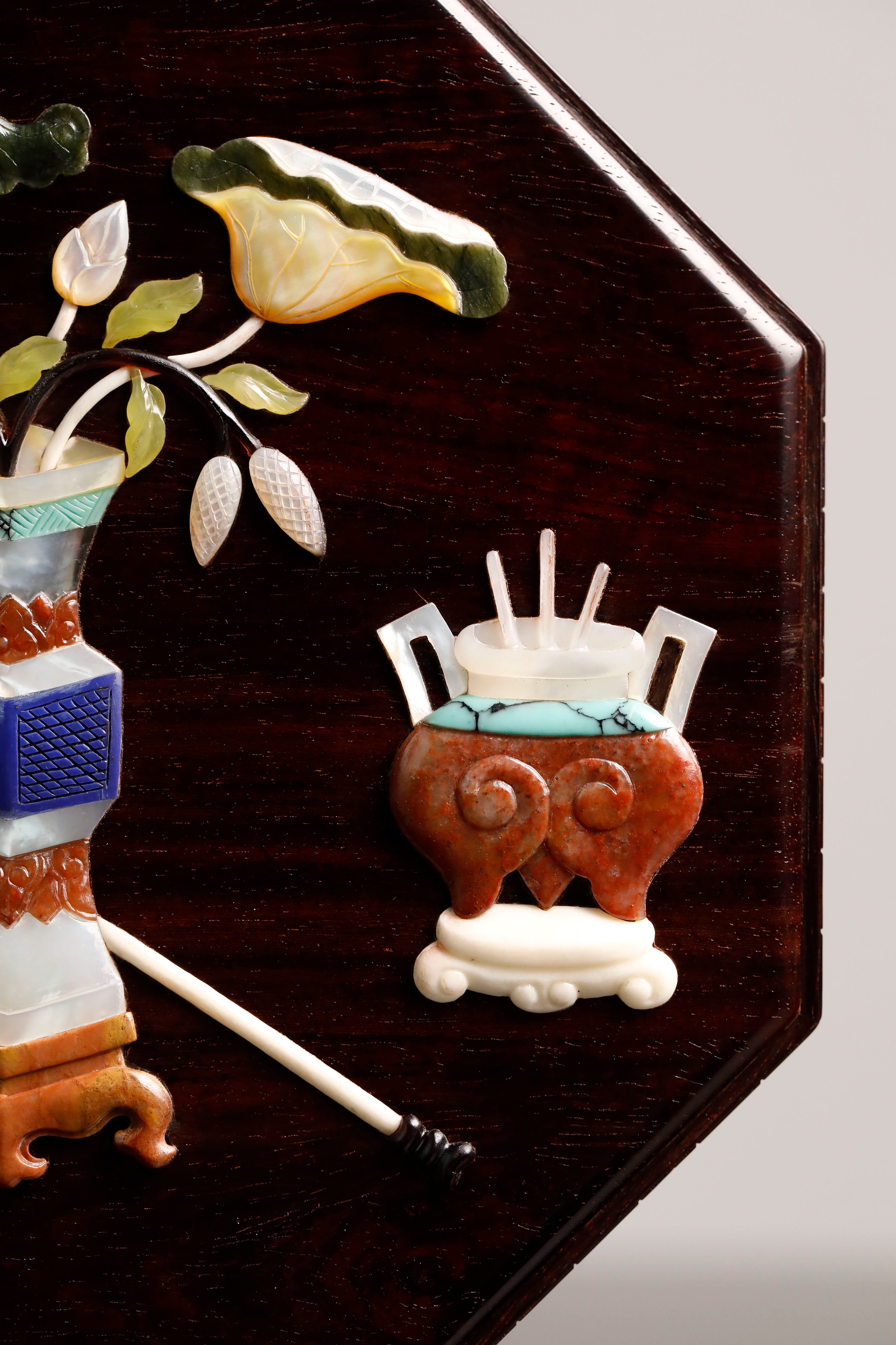 Small-leaf sandalwood octagonal box inlaid with precious stones, symbolizing joy and laughter.