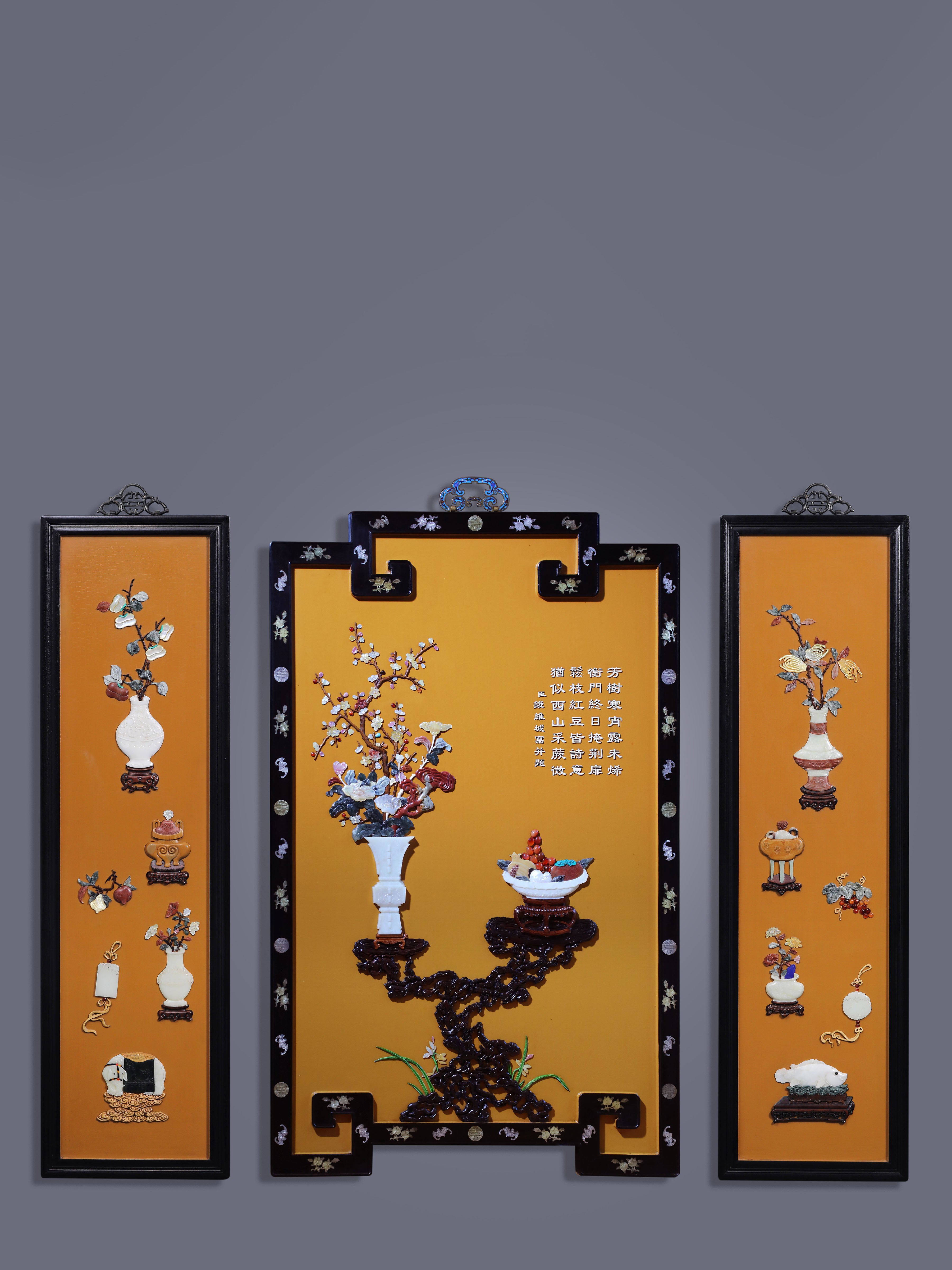 A hanging screen inlaid with precious stones, symbolizing peace and prosperity.
