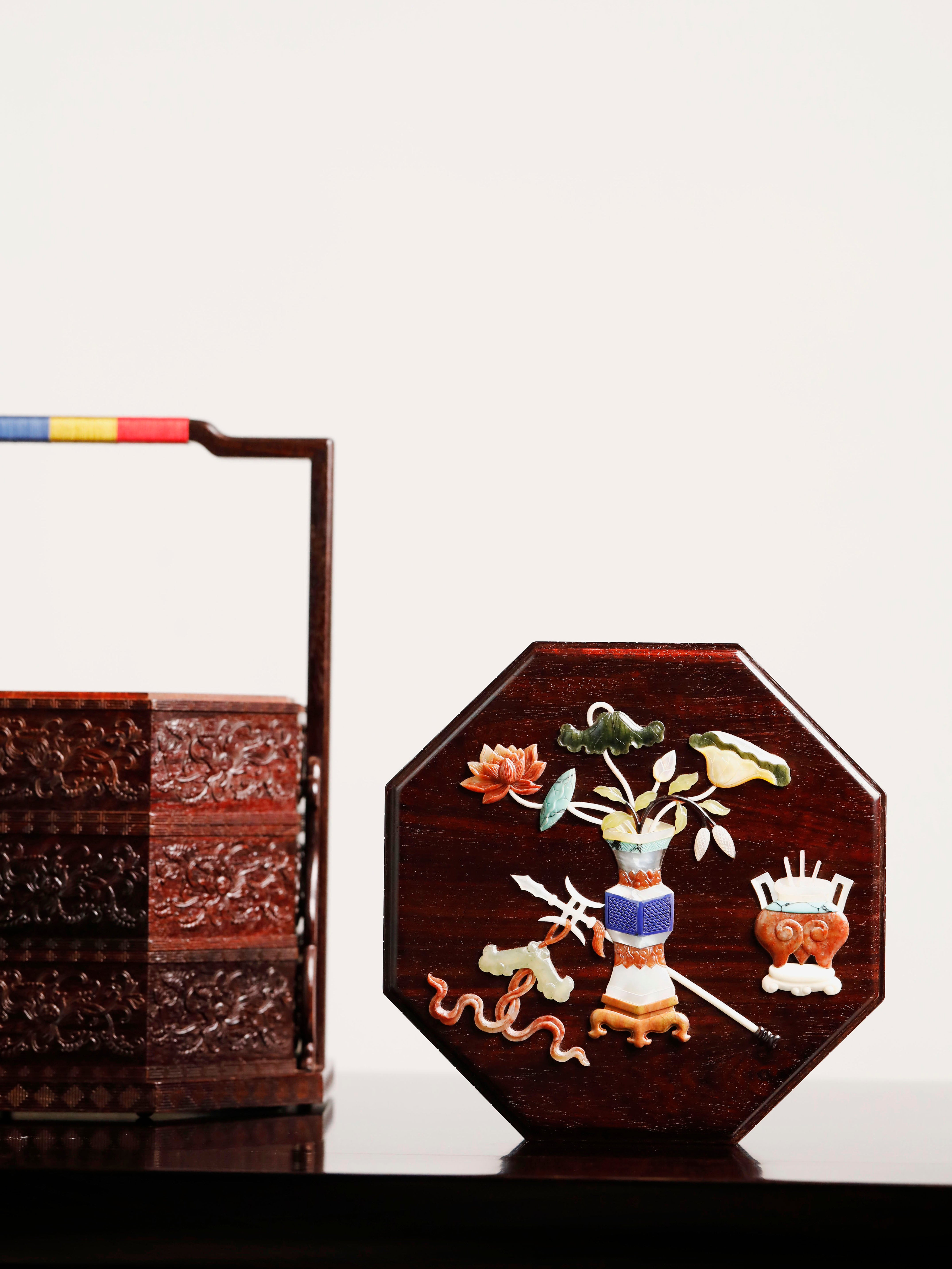 Small-leaf sandalwood octagonal box inlaid with precious stones, symbolizing joy and laughter.