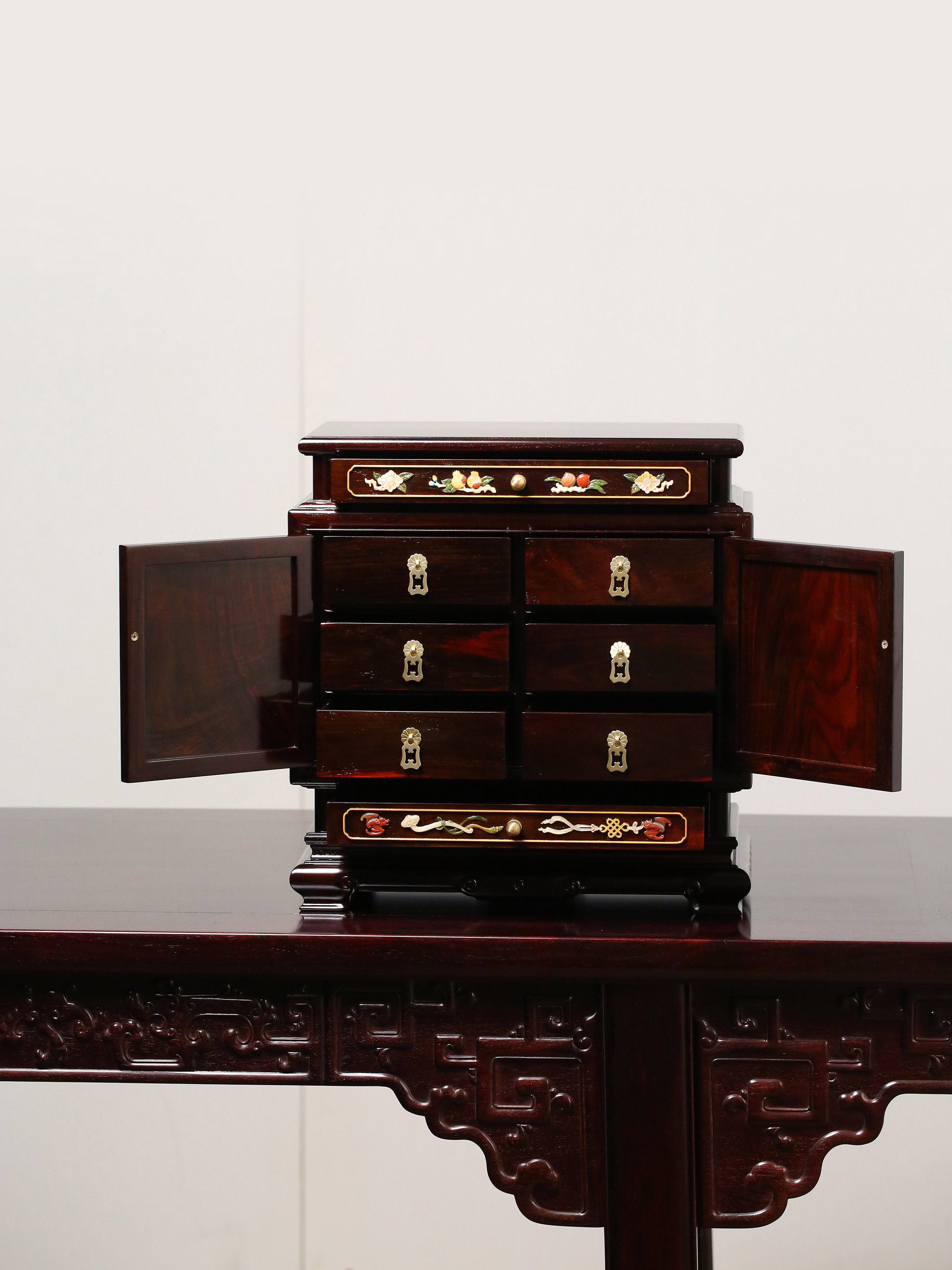 Rosewood jewelry box inlaid with ruyi-shaped feet and jade antique patterns