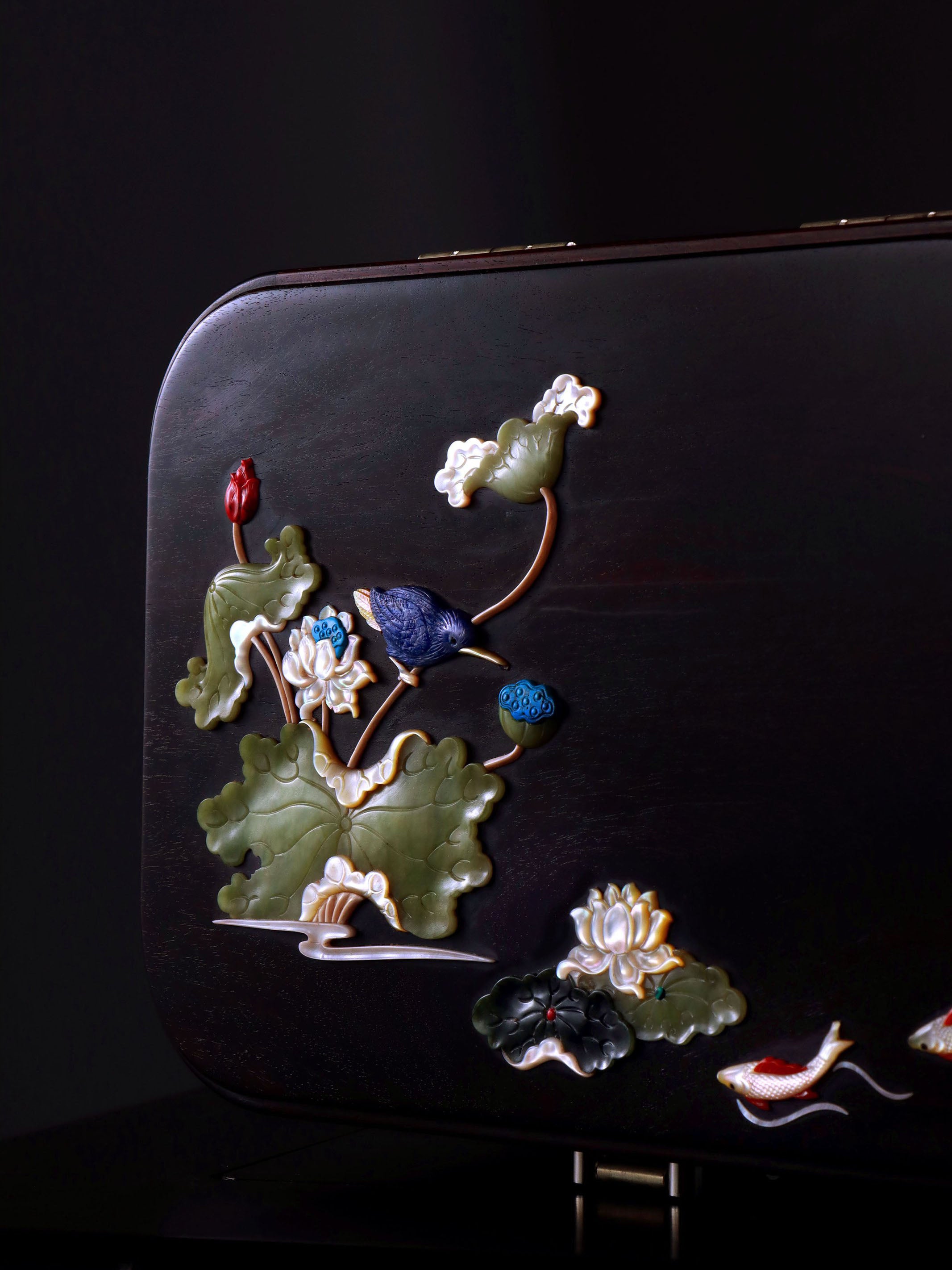 White Lotus Leaning on Kingfisher Tea Box