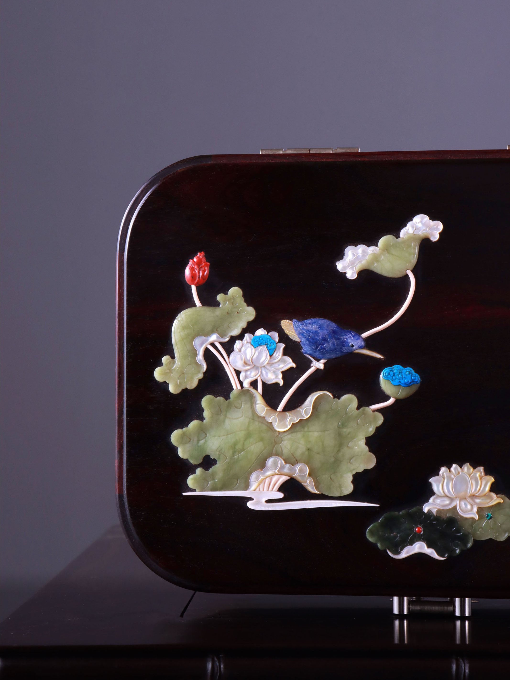 White Lotus Leaning on Kingfisher Tea Box