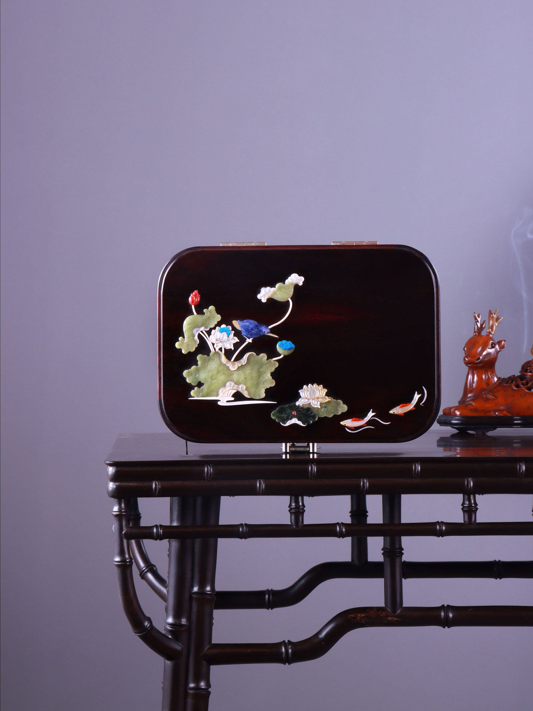 White Lotus Leaning on Kingfisher Tea Box