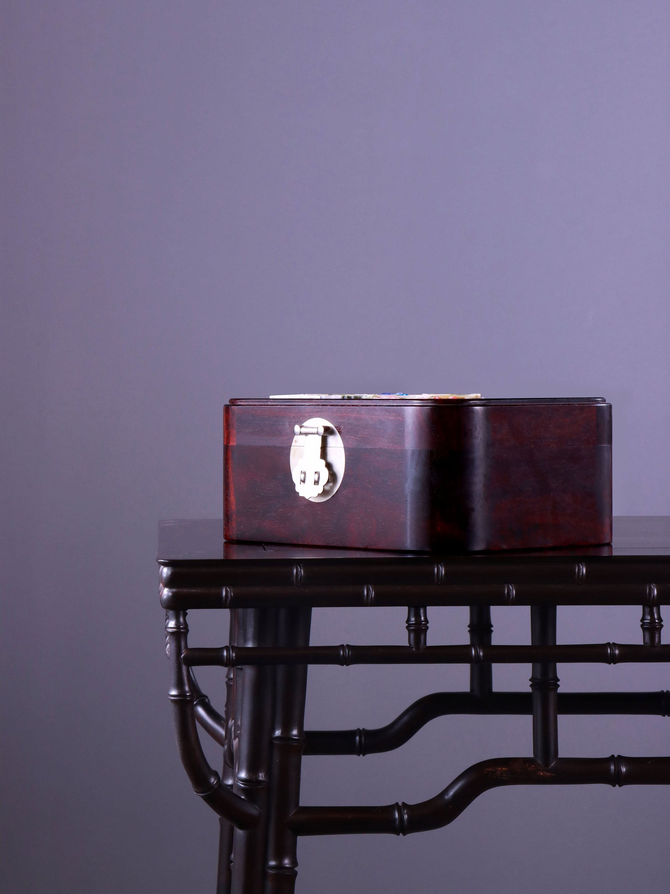 White Lotus Leaning on Kingfisher Tea Box