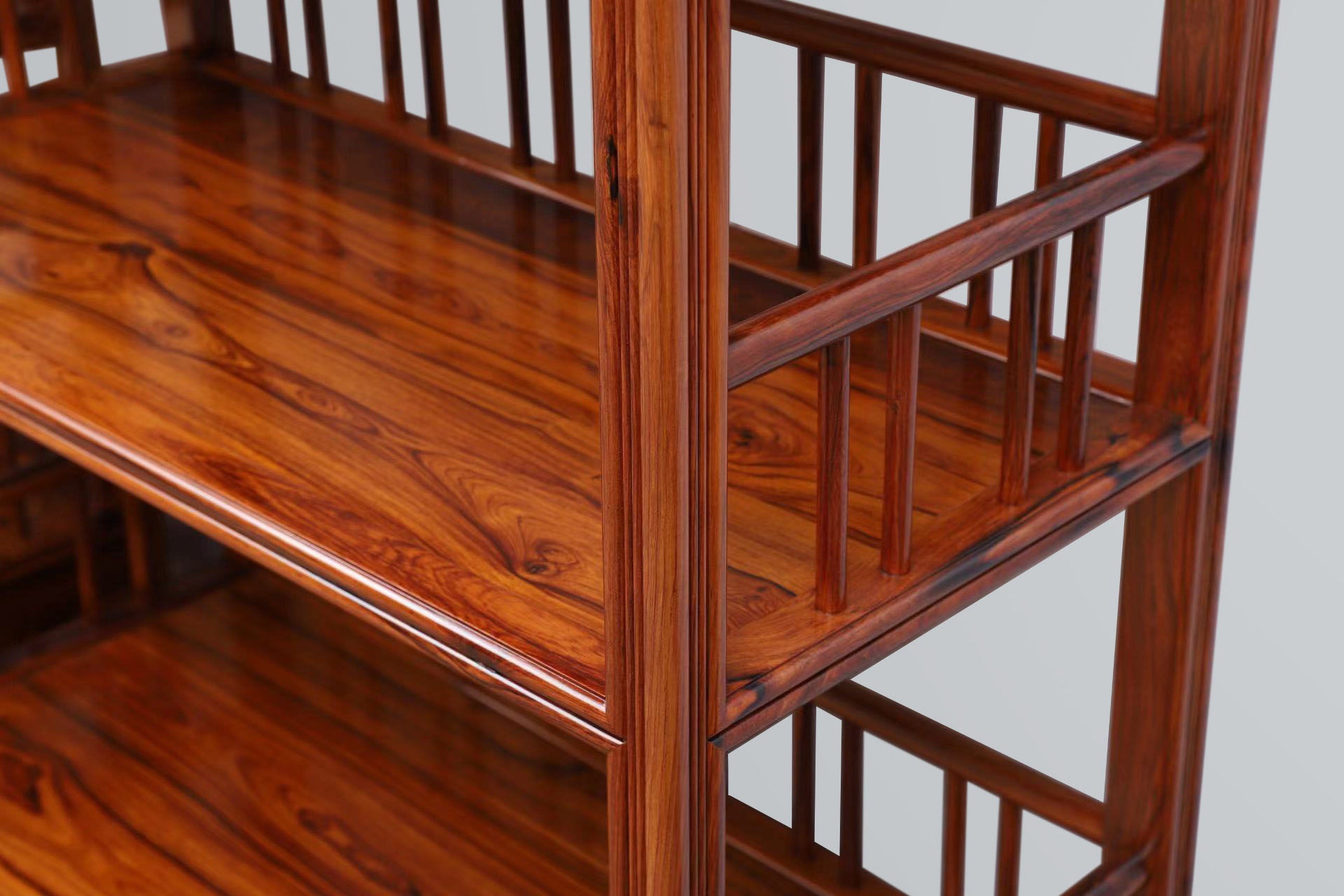 White rosewood branches sparsely sprout from the bottom of the scholar's desk.