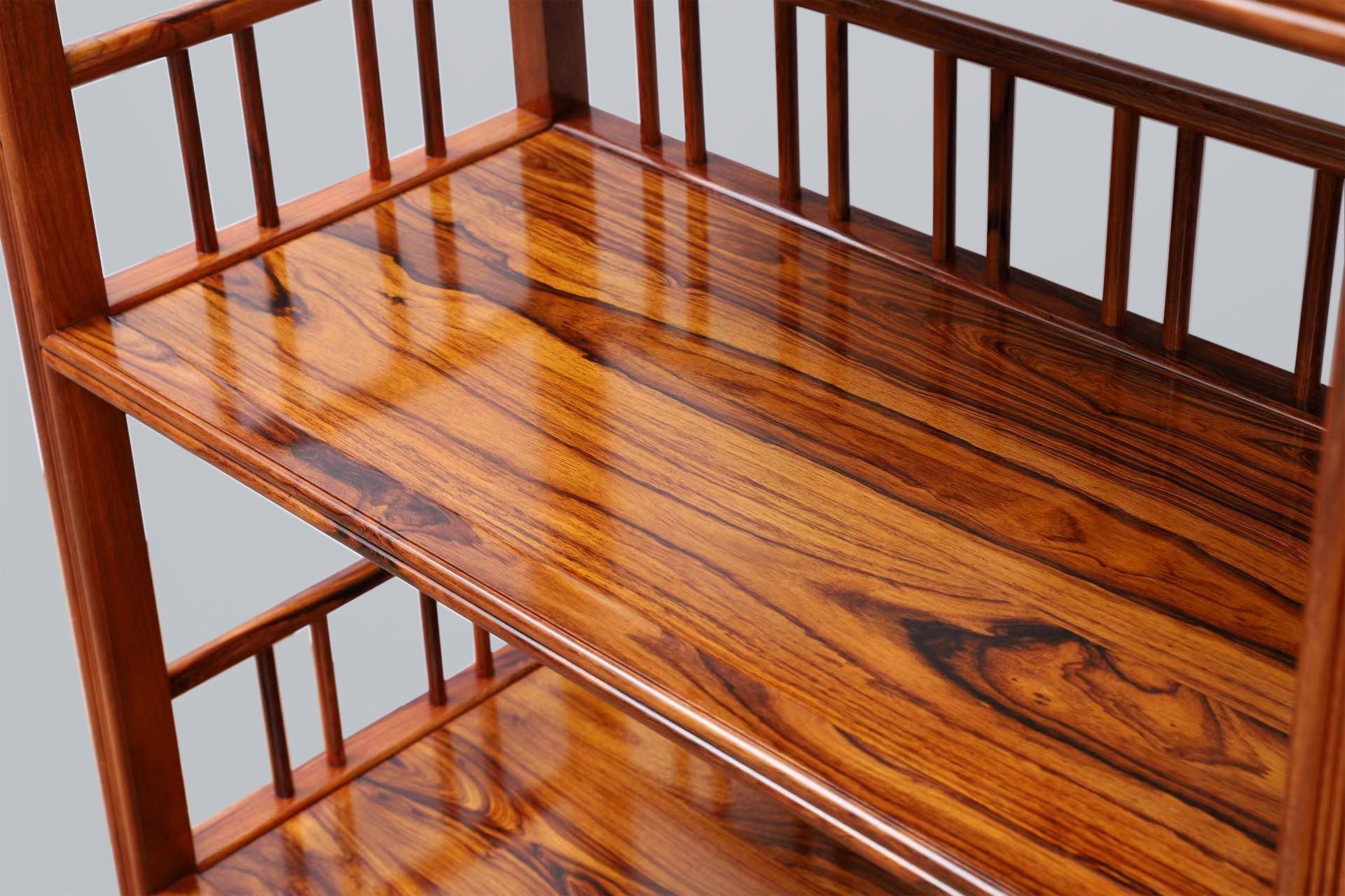 White rosewood branches sparsely sprout from the bottom of the scholar's desk.