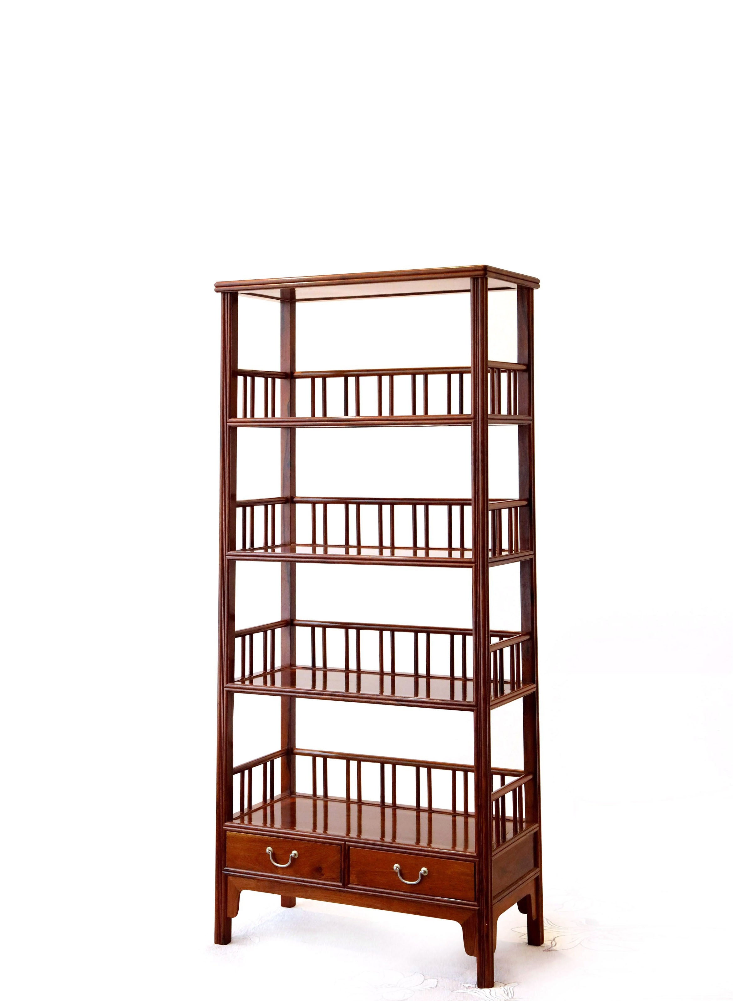 White rosewood branches sparsely sprout from the bottom of the scholar's desk.