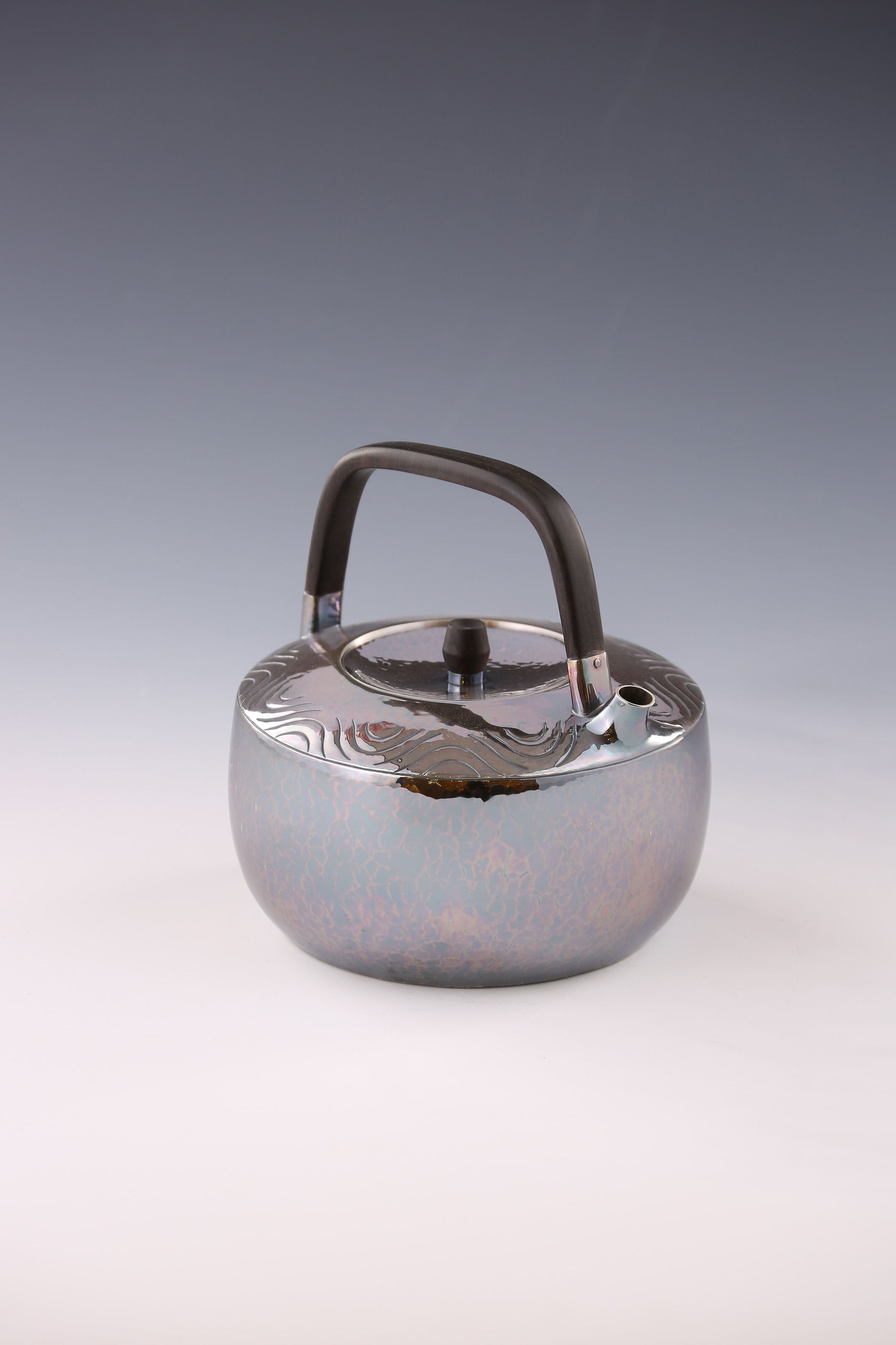 Wavy wooden handle silver teapot