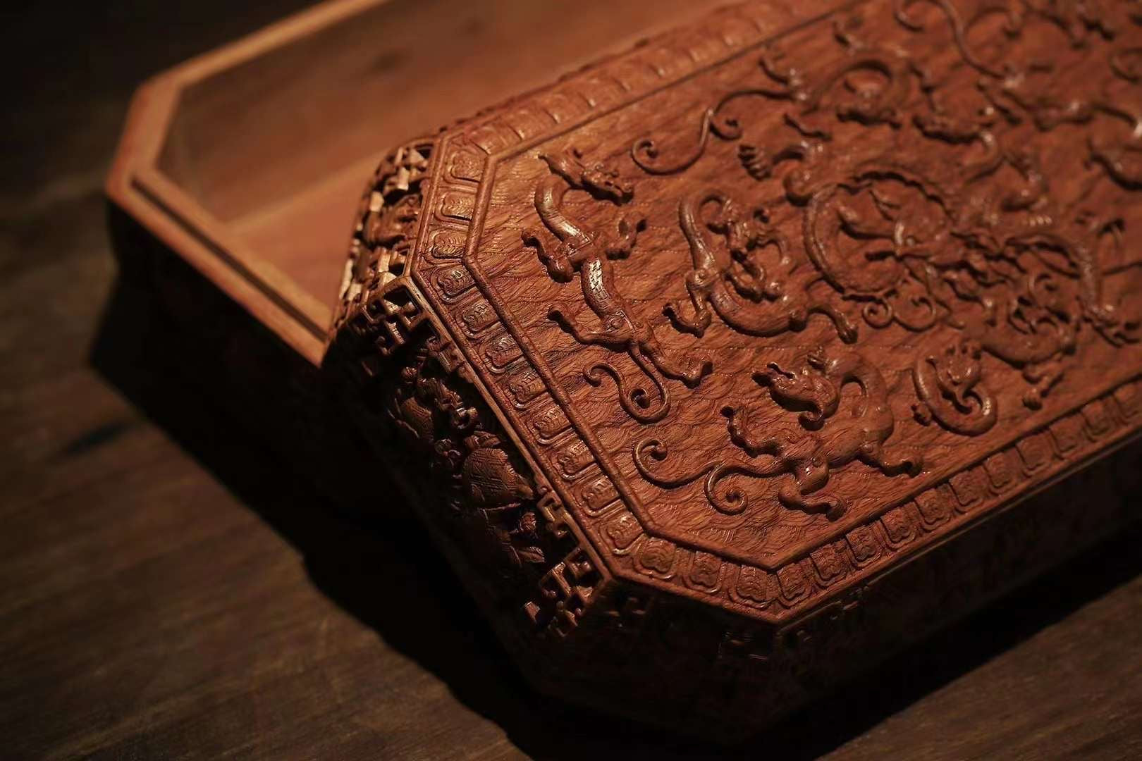 Tea box with full carving of lychee, butterfly, and dragon patterns