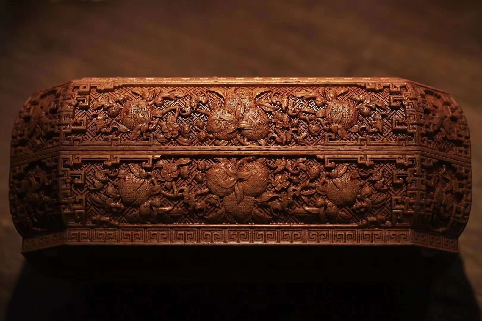 Tea box with full carving of lychee, butterfly, and dragon patterns