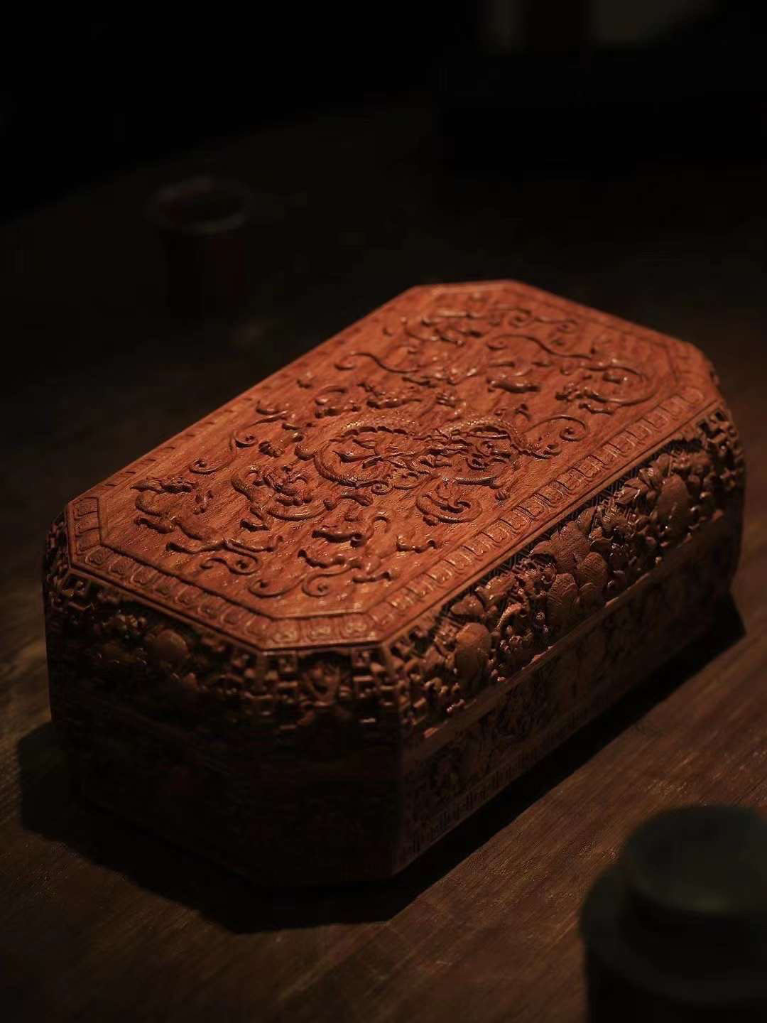 Tea box with full carving of lychee, butterfly, and dragon patterns