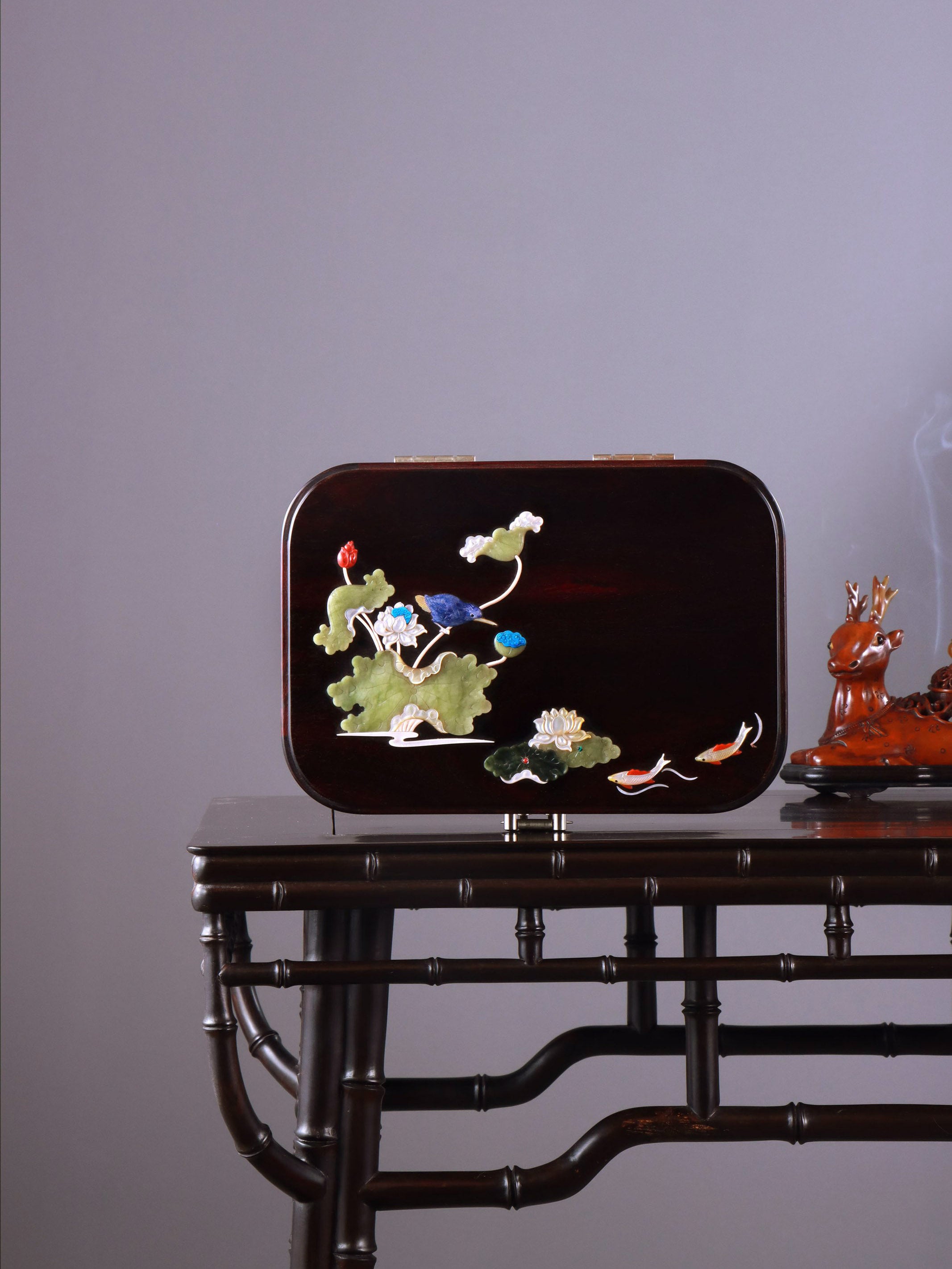 White Lotus Leaning on Kingfisher Tea Box