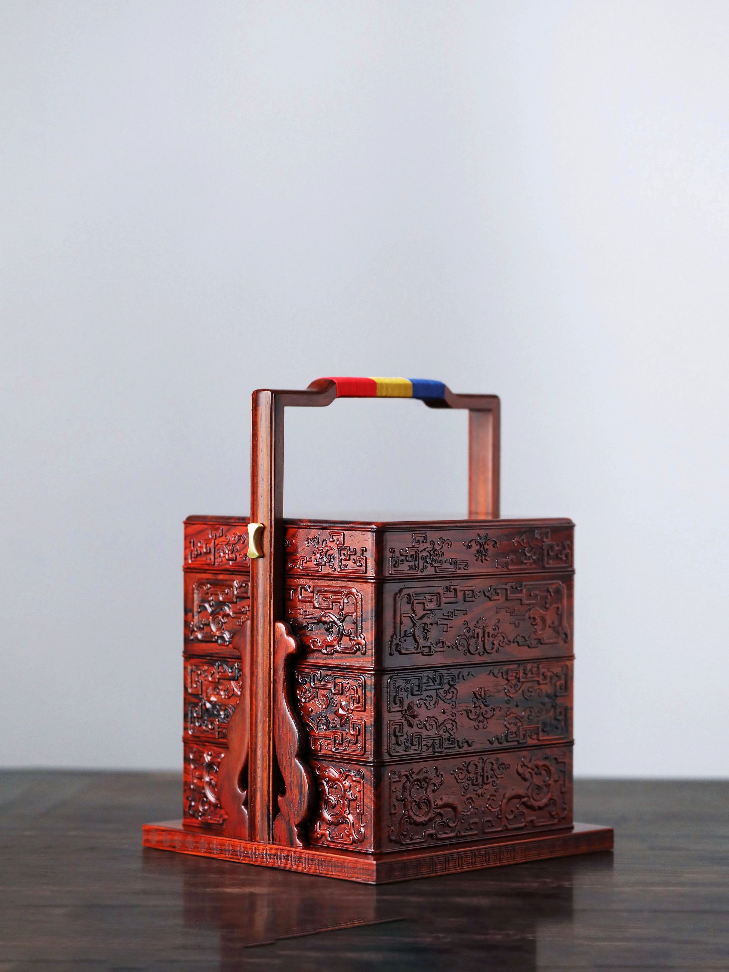 Rosewood square box with carved dragon and phoenix patterns