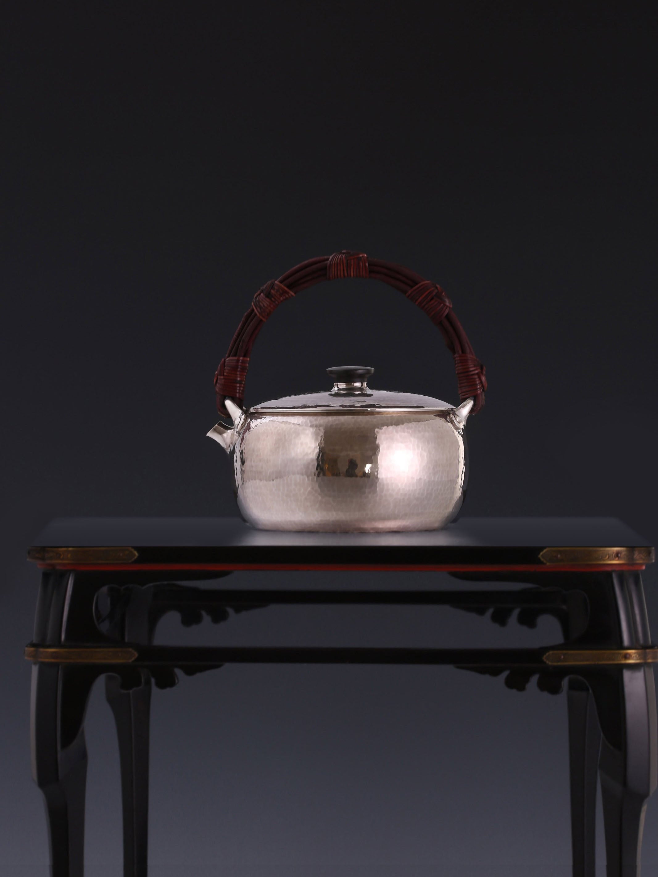 Large rattan spout, silver kettle, cast iron tea stove