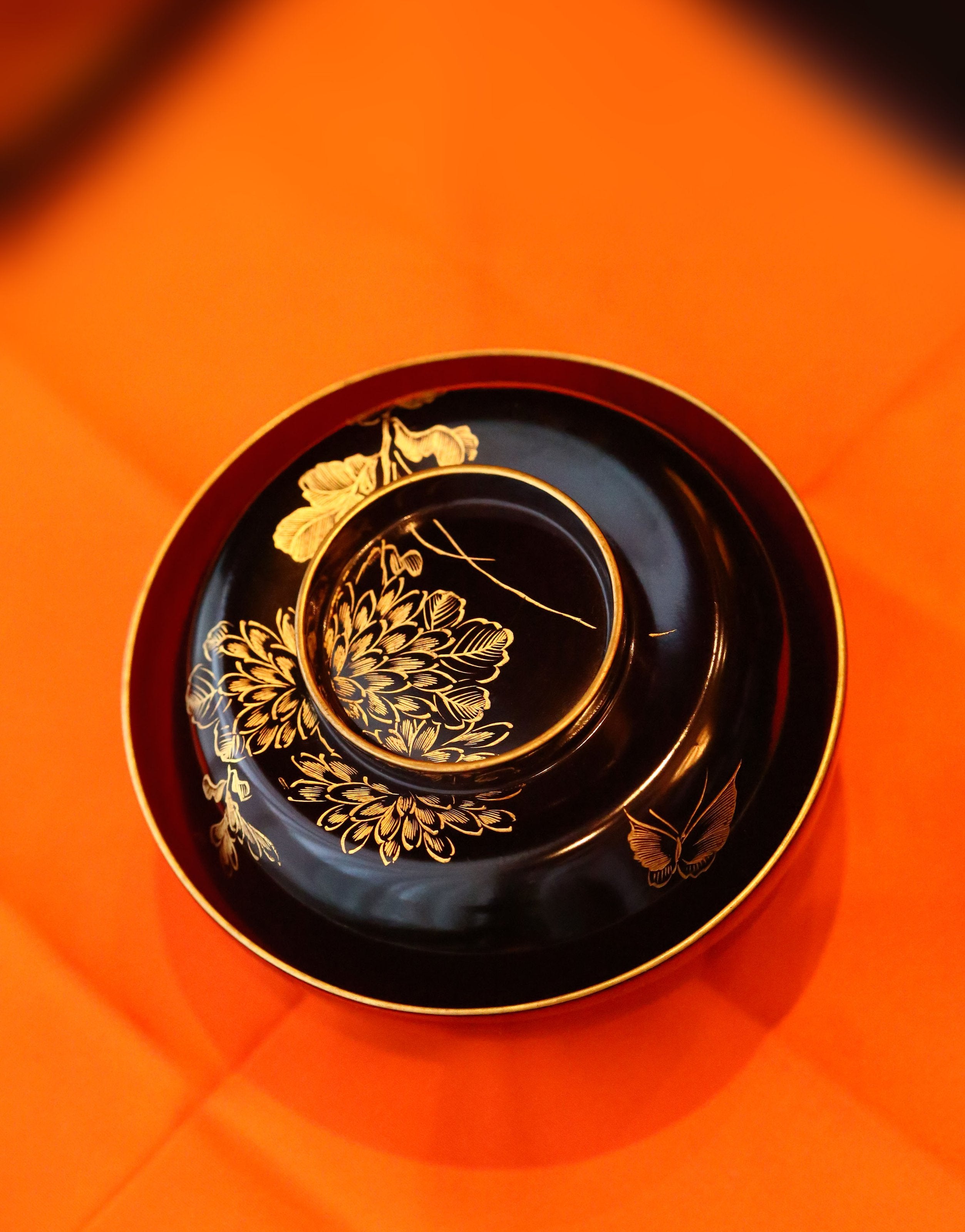 Two lacquered and gold-plated covered bowls
